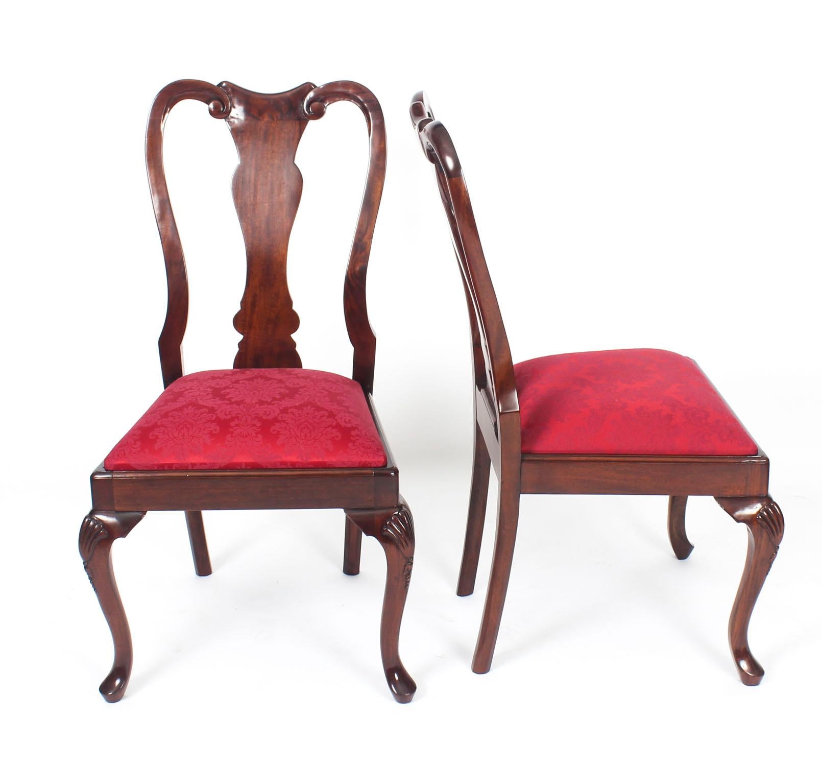 An absolutely fantastic vintage set of 14 Queen Anne style dining chairs dating from the mid-20th century.
 
The set comprises 12 side chairs and two armchairs

These chairs have been masterfully hand-carved from beautiful solid mahogany and the