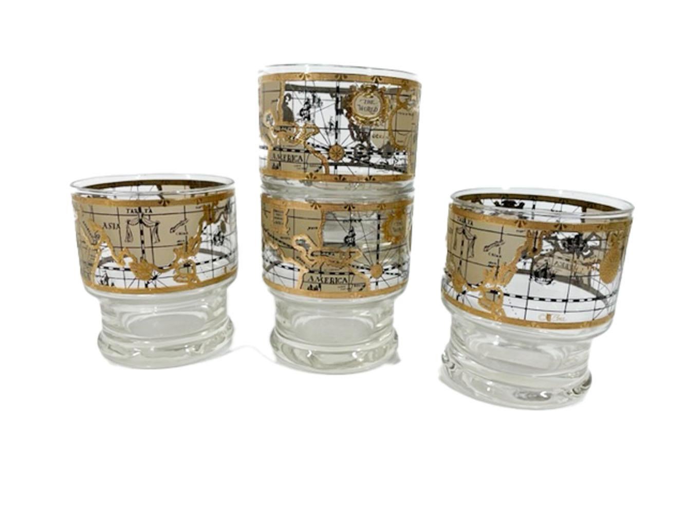 Set of 4 Mid-Century Modern stacking / footed rocks glasses by Cera in the Old World Map pattern, with a map designed to look like an antique map on parchment in tans and 22k gold.

We have multiple listings for the old world map pattern in other
