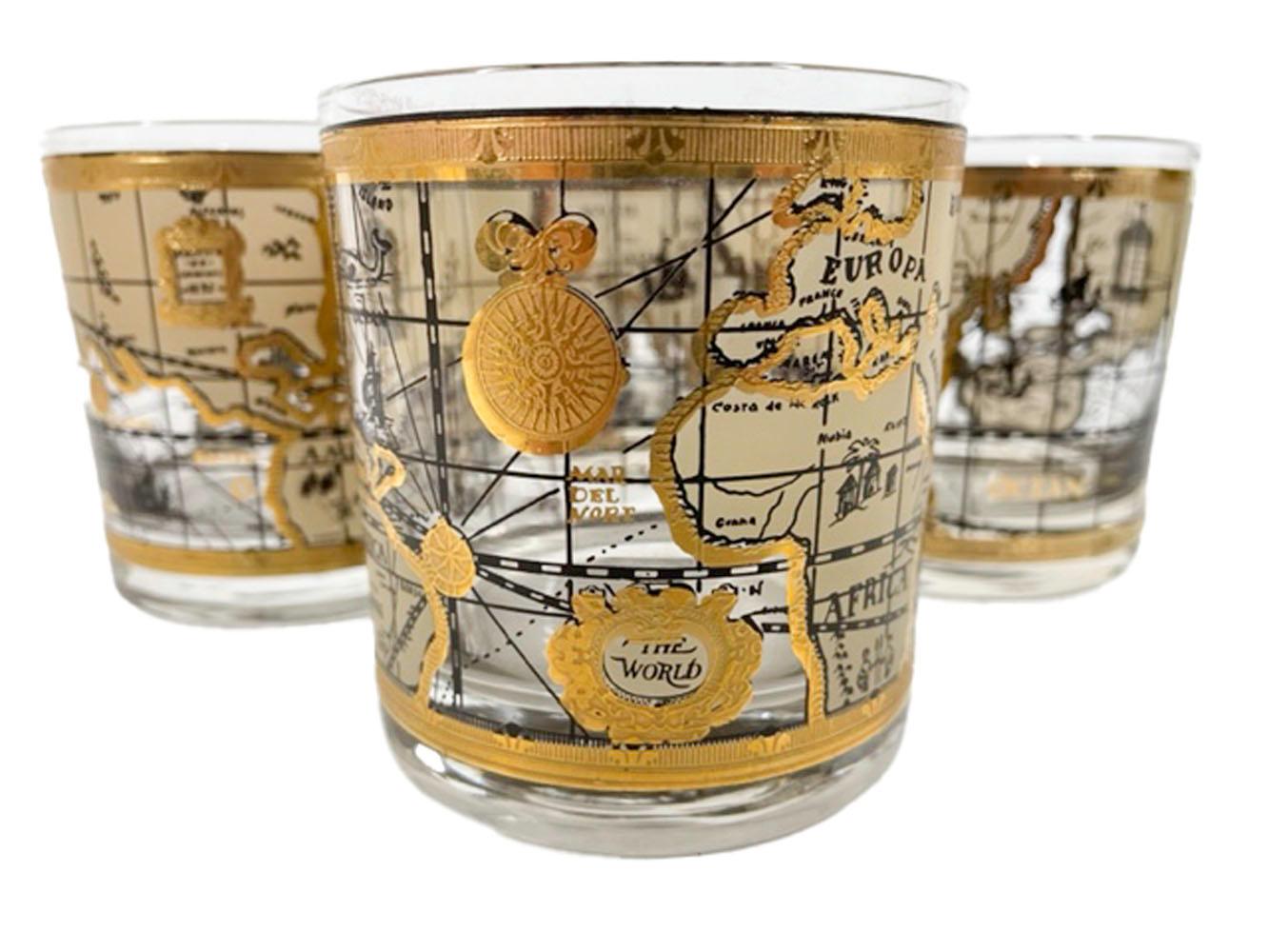 Set of 4 Mid-Century Modern rocks glasses by Cera in the Old World Map pattern, with a map designed to look like an antique map on parchment in tans and 22k gold.

 