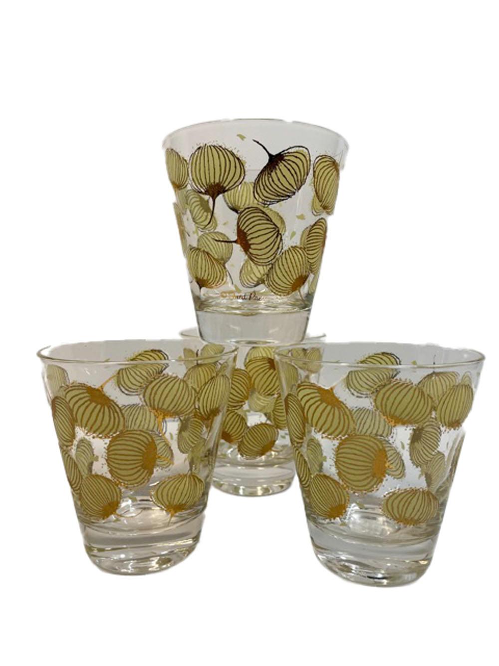 Four Mid-Century Modern double old fashioned glasses designed by and signed Fred Press with a random pattern of cocktail onions in yellow enamel with 22k gold highlights.