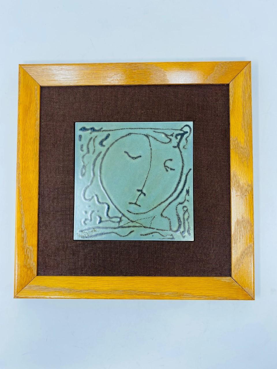 Beautiful tiles by American ceramic artist Harris G Strong. Harris G Strong stands for his iconic work in earthenware hand painted tiles. This set of 4 framed tiles with different themes, become cohesive as a group as they are beautifully executed