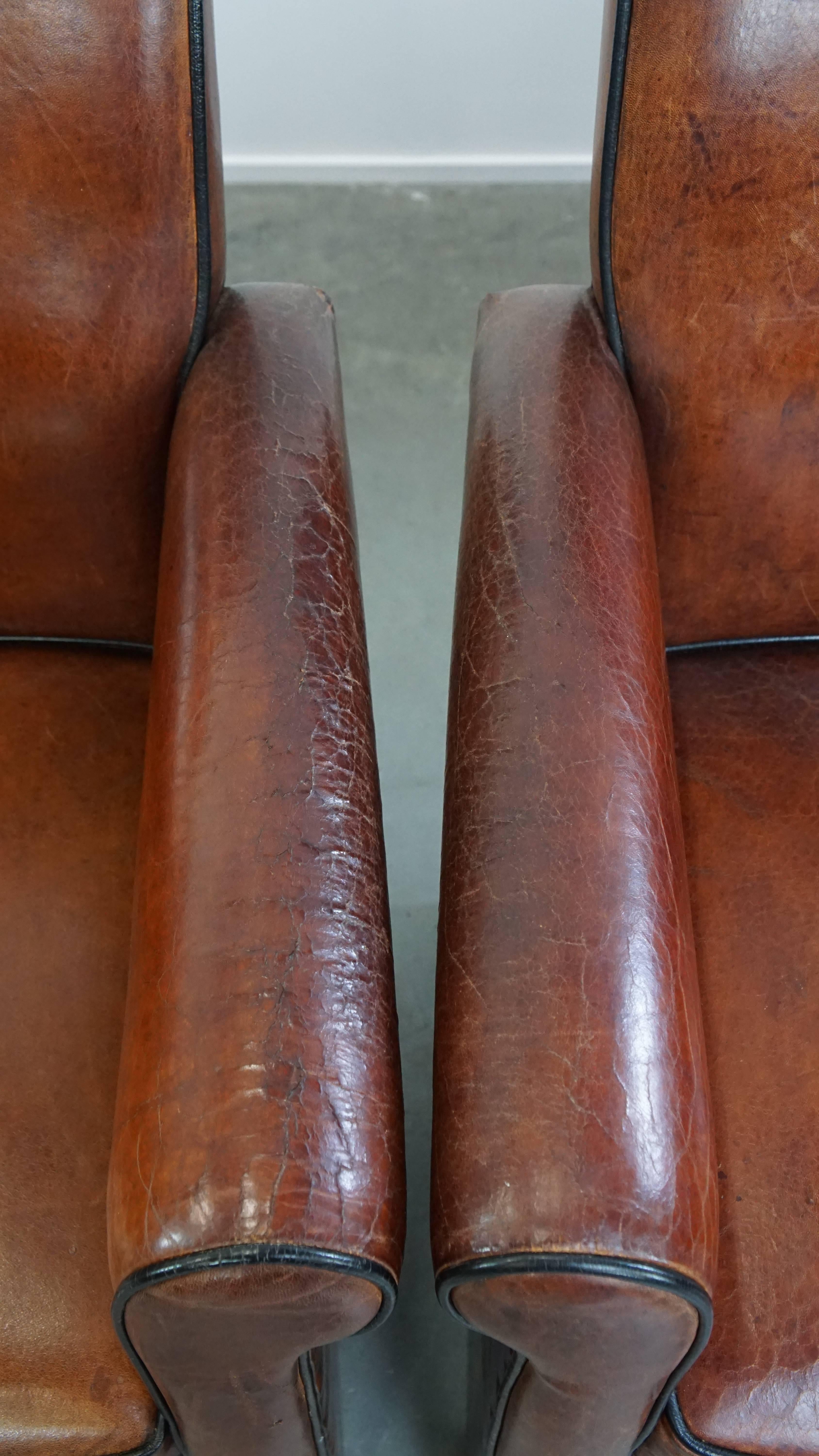 Vintage set of 4 sheepskin leather dining chairs on castors en vente 5