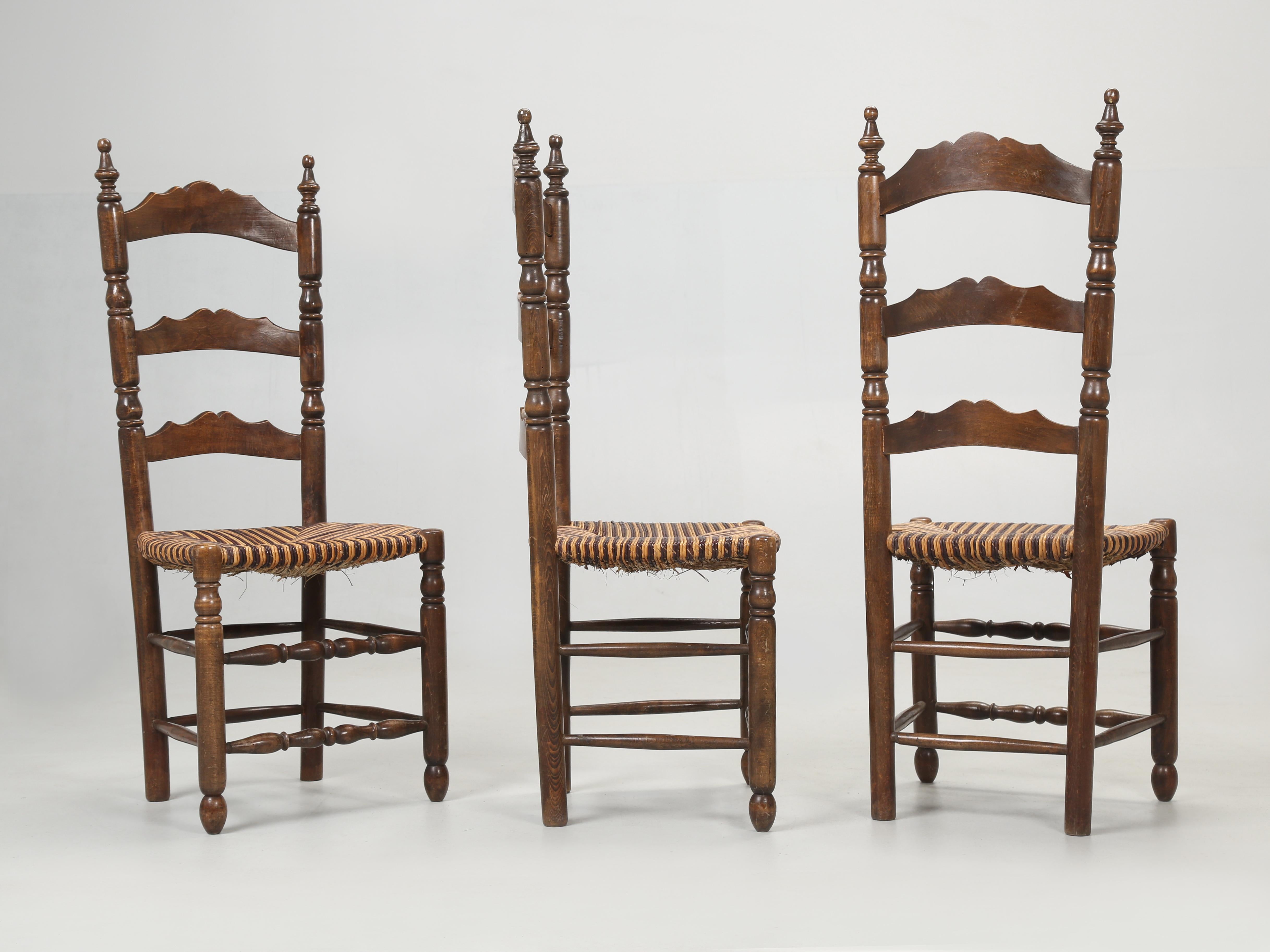 Set of (6) Country French dining chairs with rush seats that were probably made in the late 1950's or 1960's. Condition of the rush seated country French dining chairs is respectable and structurally they are sound. 
Original, as is condition.