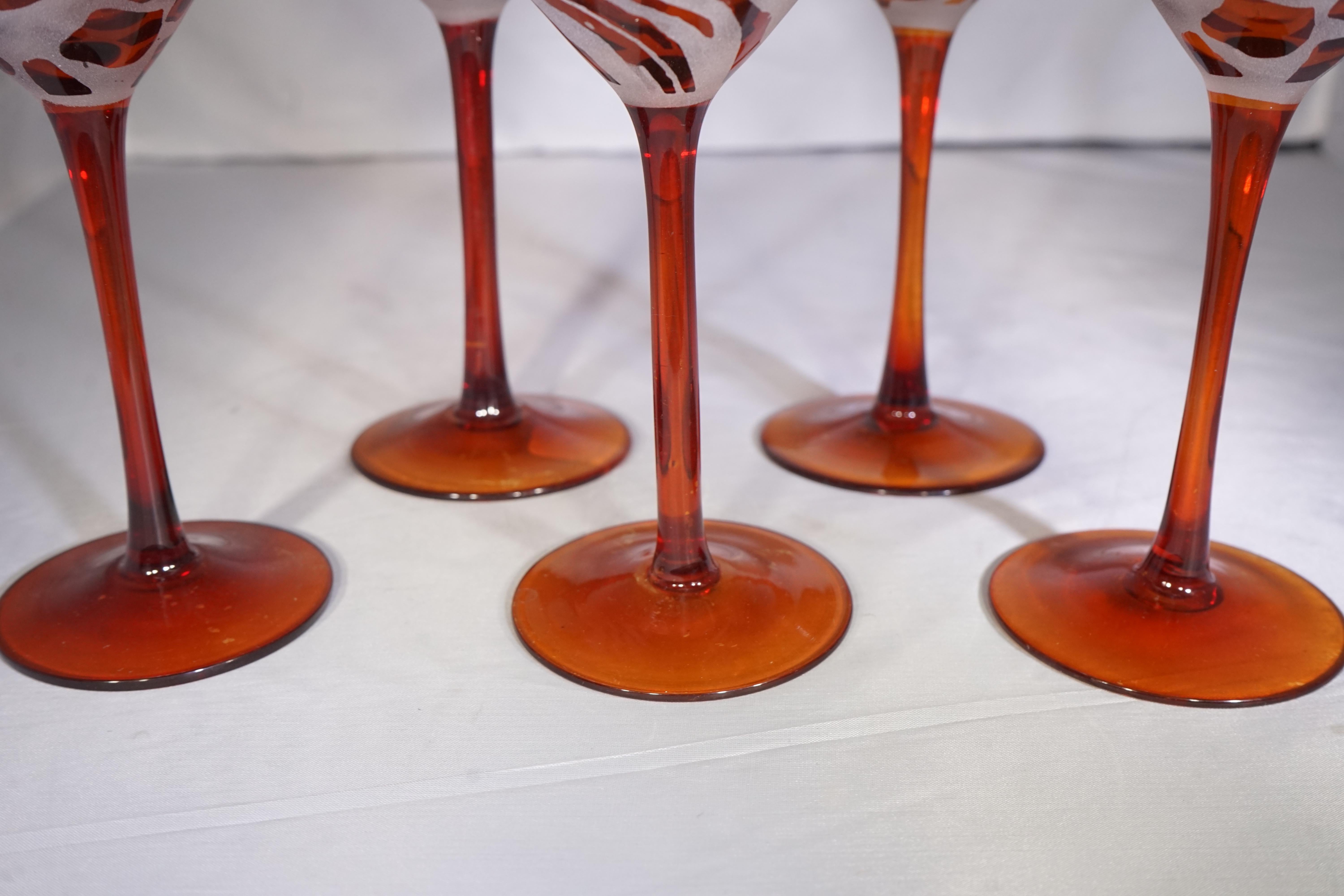 Set of five vintage orange and white frosted glass animal print martini glasses.