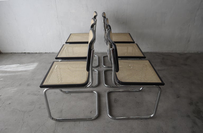 All original, Vintage set of armless Cesca chairs Marcel Breuer for Knoll. They are finished in ebonized beech and cane. Originally designed in 1928, this is a truly Classic and timeless design. Chairs are marked Made in Italy and retain their Made