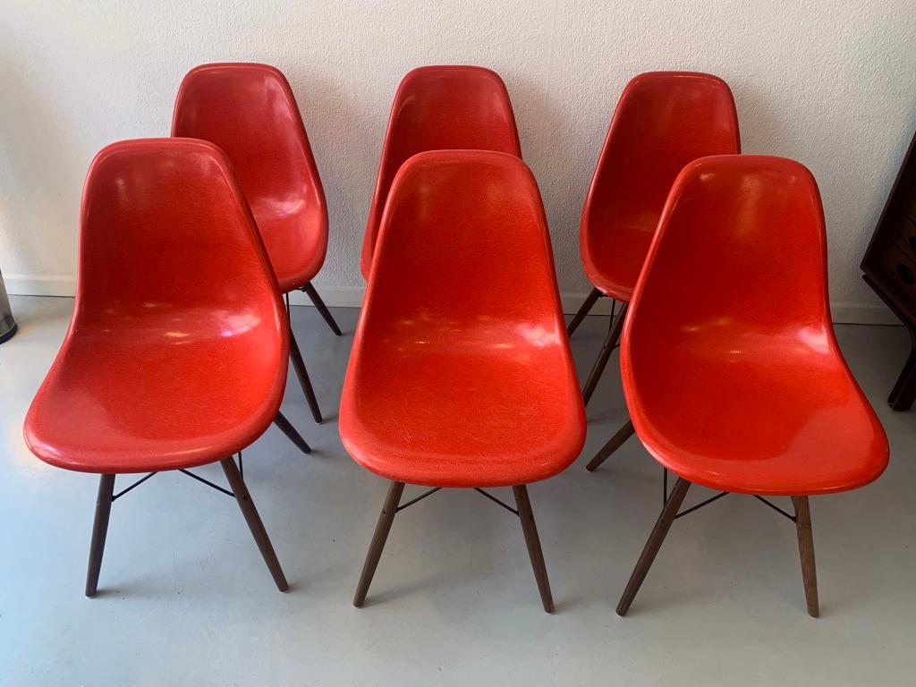 Set of 6 vintage cherry red fiberglass dowel side chairs by Charles & Ray Eames, Vitra ca. 1970's
Very good condition, solid walnut new bases.
  