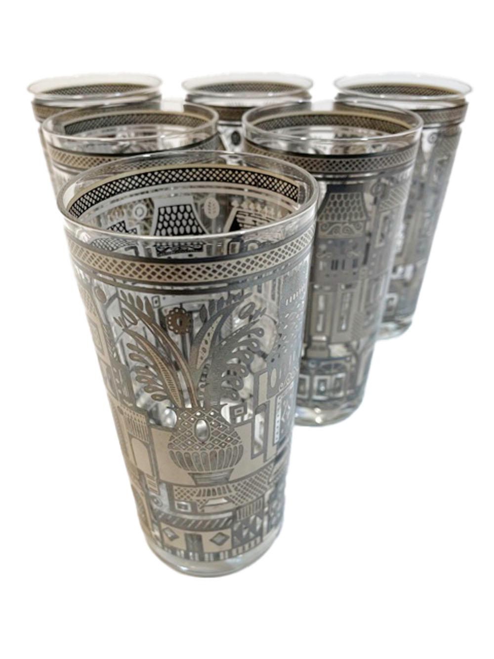 Set of 6 Georges Briard highball glasses in the Facade pattern executed in silver with tan enamel. Depicting townhouse facades on the front and a large potted plant on the reverse.