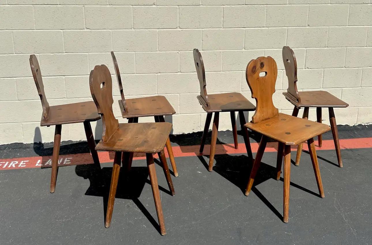 Wonderful set of six dining chairs made of pine wood. They are in good vintage condition. No issues. They’re very sturdy and strong. Absolutely well made. This amazing chair goes really well with some farm houses vibes.