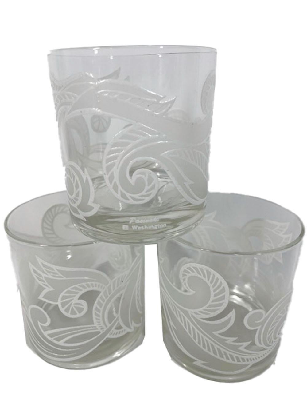 Six vintage cocktail glasses designed by Irene Pasinski for Washington Glass, decorated with a scrolling leaf motif with white frosted fields with raised white outline and detail.