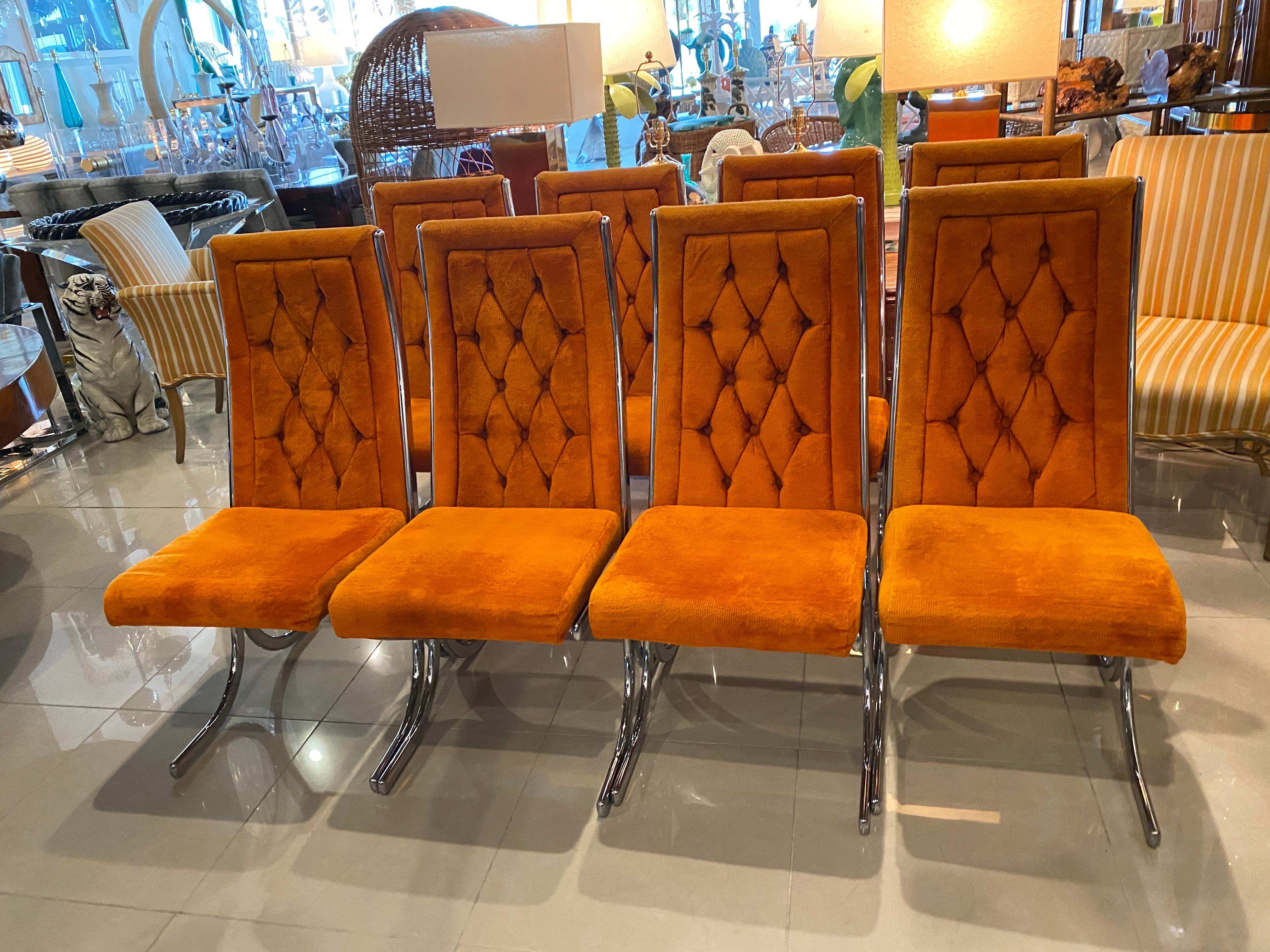 Lovely set of 8 vintage chrome cantilevered side dining chairs by Howell Co. Each seat is marked underneath Howell. These have tufted backs with all original upholstery. These will need to be upholstered as the original fabric has some tears and