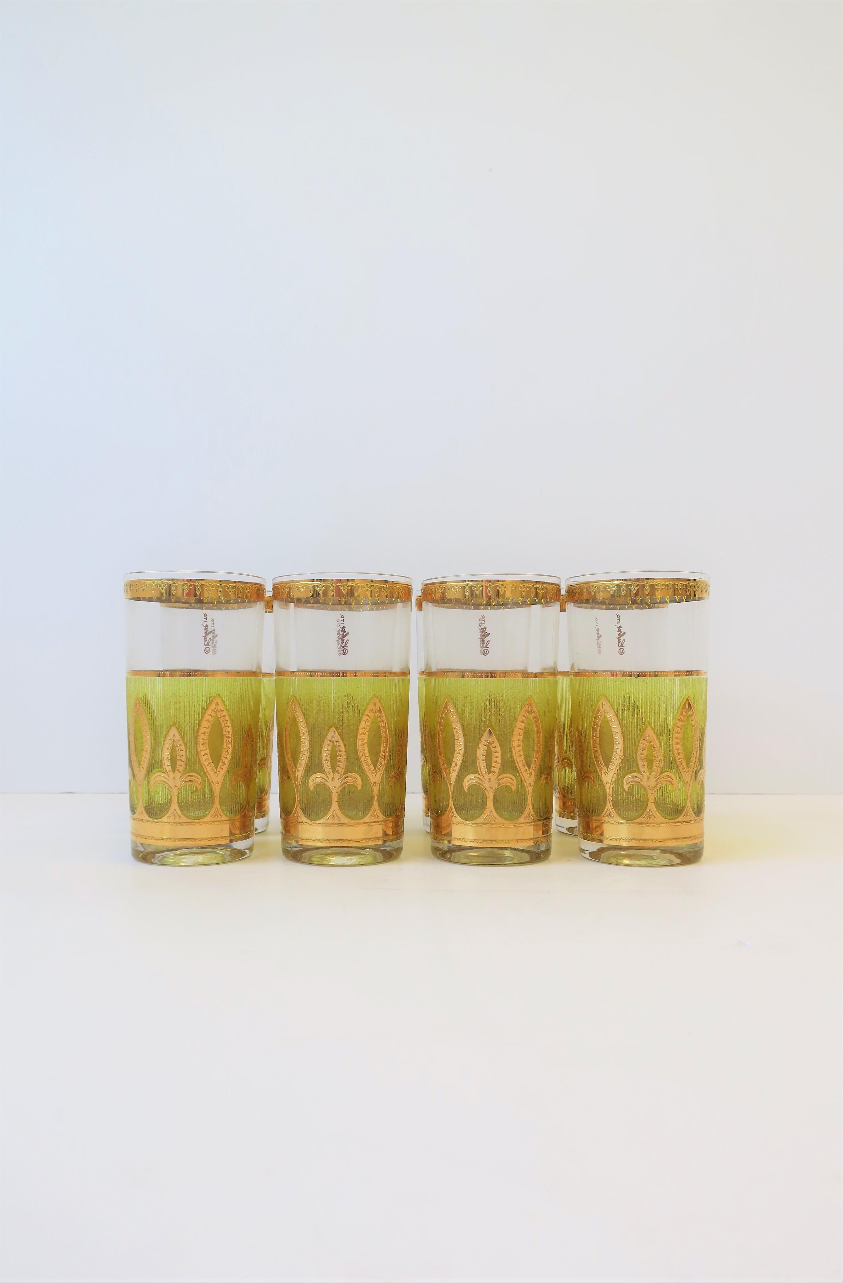 A beautiful set of 8 vintage mid-20th century canary yellow and 22-karat gold highball cocktail glasses with a Fleur-de-lis design, in the Hollywood Regency style, circa 1960s, U.S. Great for summer or holiday entertaining, bar cart or bar area,