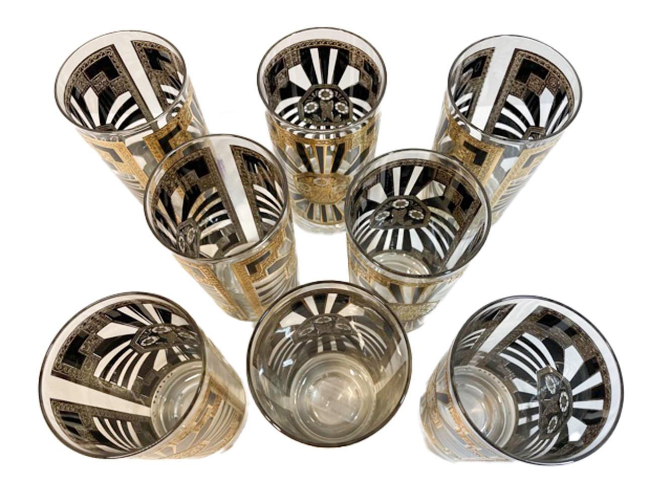 Mid-Century Modern, set of 8 highball glasses designed by Georges Briard in the Art Deco pattern of Classic motifs executed in black enamel and 22k gold with platinum details.