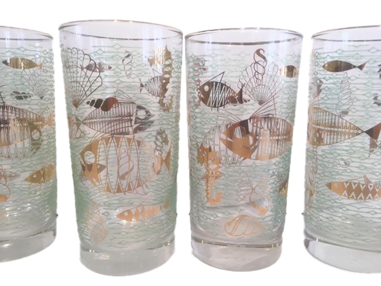 Libbey Glass Co., highball glasses in the Marine Life pattern. Stylizes gold fish, shells and other sea life against a ground of raised stylized waves of translucent green enamel. Libbey discontinued this pattern in 1959. All in excellent condition.