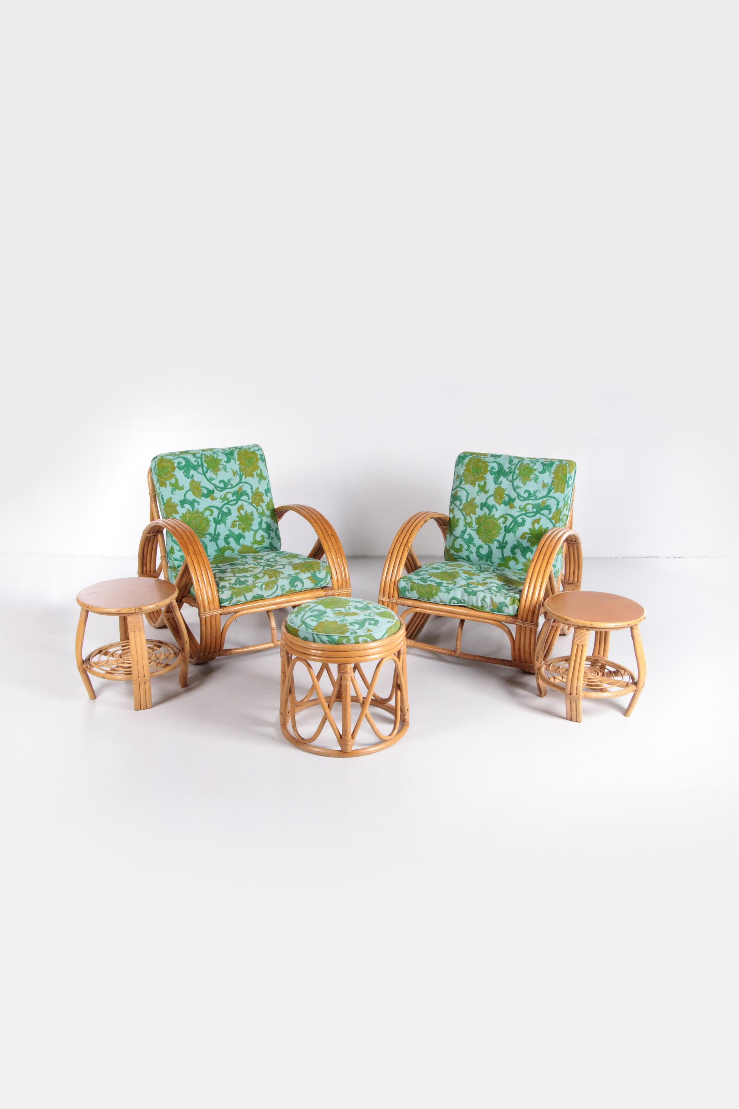 Vintage set of bamboo lounge armchairs and ottoman with side tables Paul Frankl, 1960s

This beautiful set of two bamboo armchairs and an ottoman with cushion and two beautiful side tables by Paul Frankl. The chairs were produced in France around