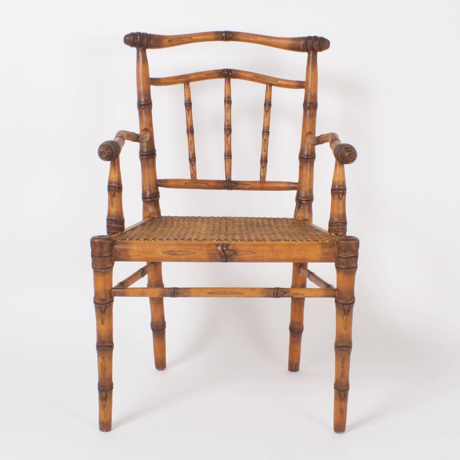 Vintage set of eight carved wood faux bamboo chairs with caned seats and a sophisticated rustic charm. Carved in the mid century style with an expertise that includes the rarely seen root ball and a confident, comfortable stance.
        