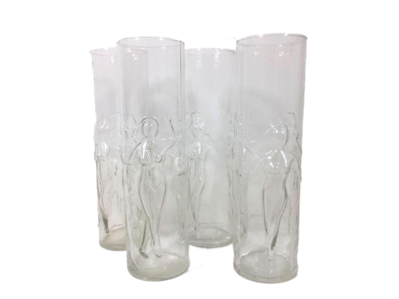 Mid 20th century set of 8 Libbey Tom Collins or Zombie glasses, of large size, in the Le Femme pattern. Each glass is molded in three panels, each with a raised image of a women in a different pose.