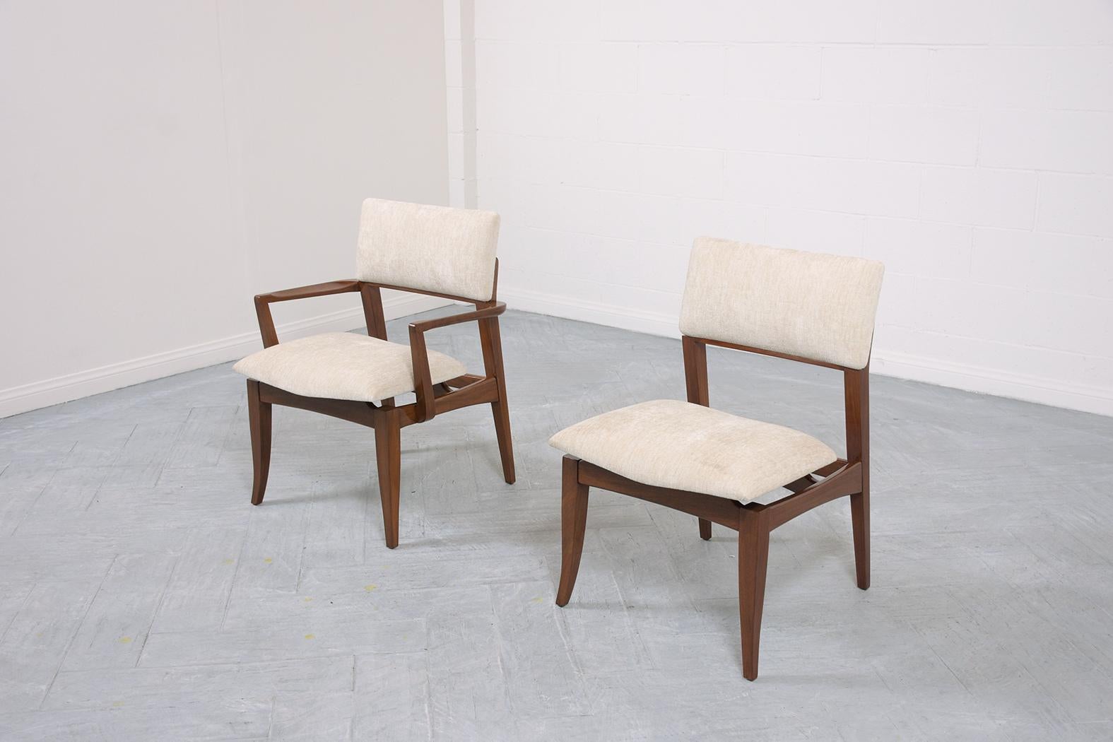 An extraordinary vintage set of eight mid-century modern dining chairs in excellent condition beautifully crafted out of walnut wood and has been professionally restored upholstery and upholstery by our expert craftsmen team. This set of vintage