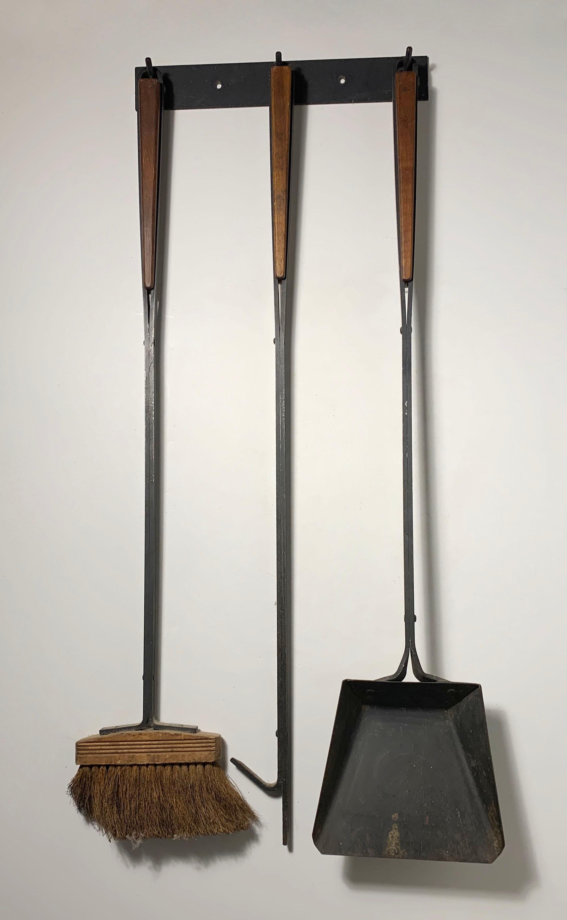 Vintage set of fireplace wall hanging tools. Attributed to Arthur Umanoff. In the manner of Jens Quistgaard and Paul McCobb.