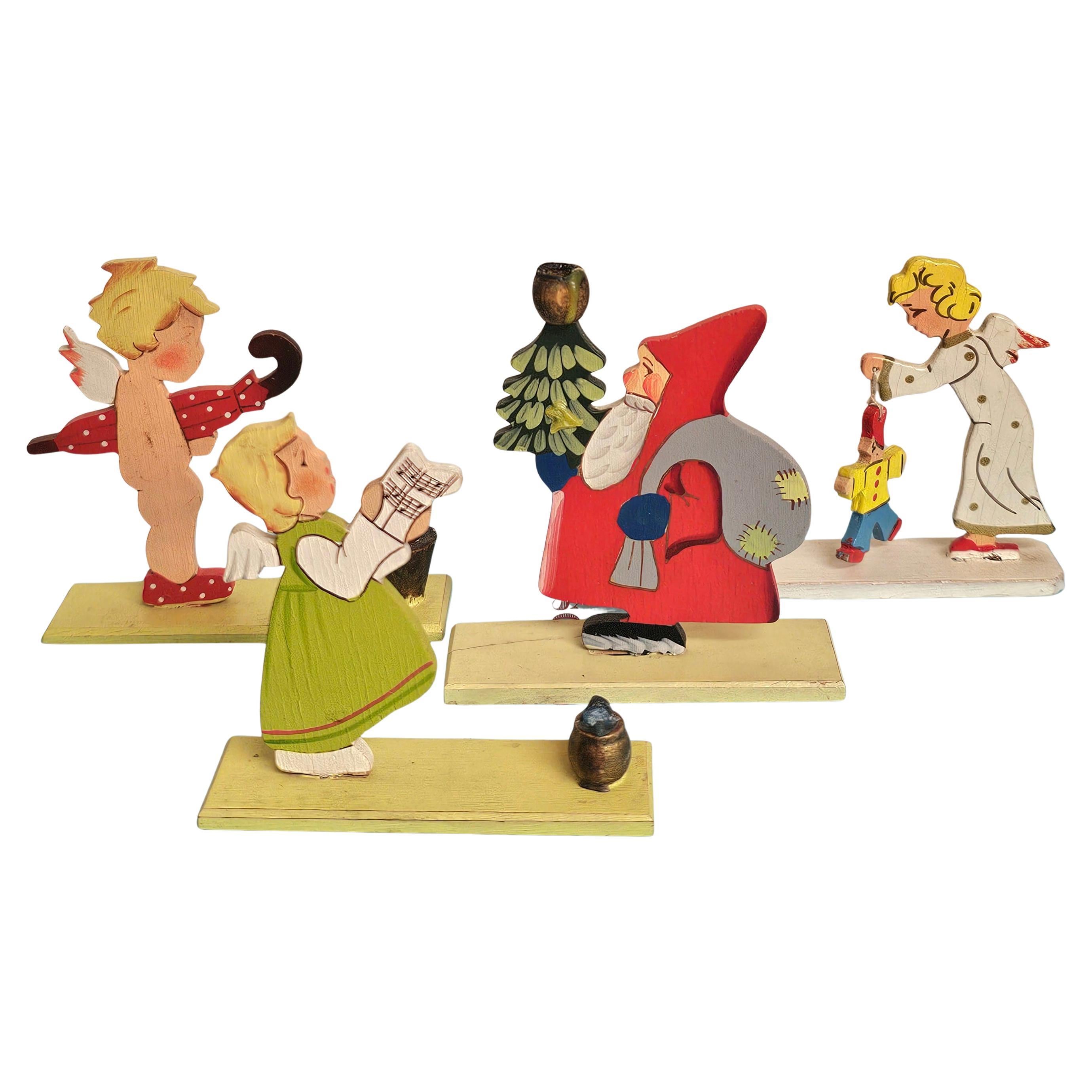 Set vintage di cinque portacandele natalizi Erzgebirge Germania