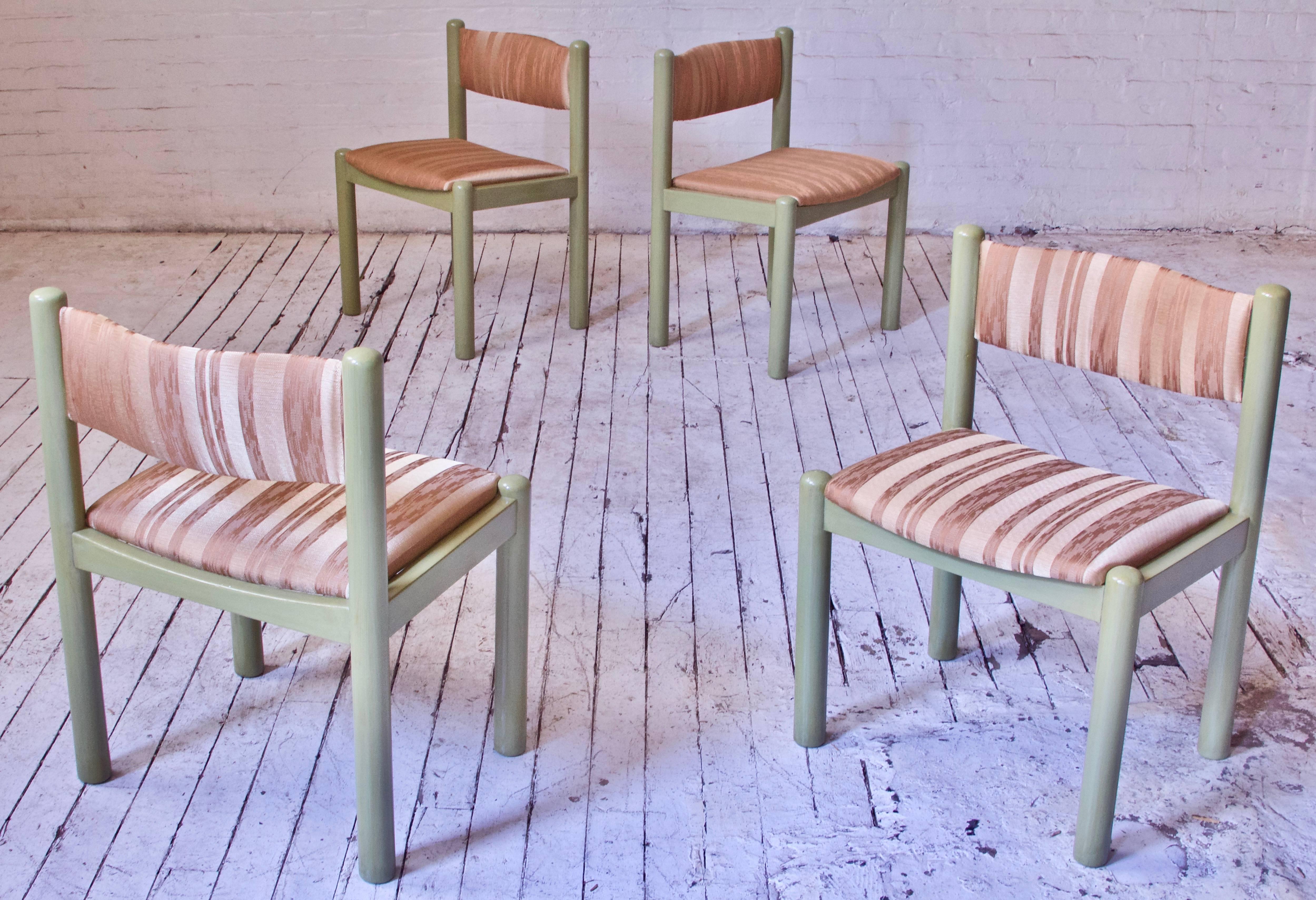 Interesting set of four vintage Italian dining chairs in the manner of Vico Magistretti with hand-glazed 'Verona Green' oak frames, reupholstered with a lovely textured apricot Italian silk blend. The variegated silk material contains multiple tones