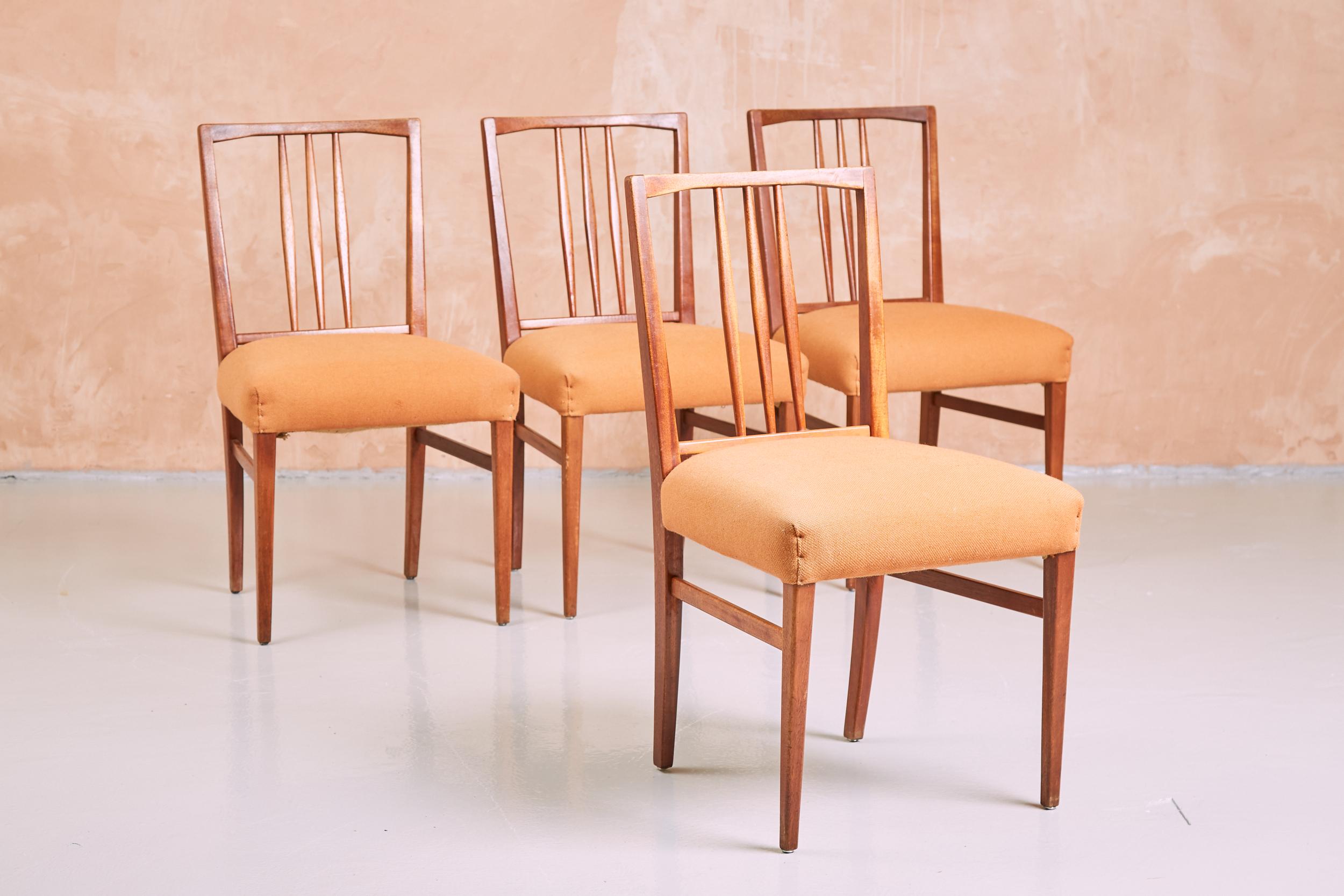 A beautiful set of four 1950s Gordon Russell Dining Chairs.
Upholstered in their original wool covering.

Designed by WH ‘Curly’ Russell in 1954, these model 6409  were made for Heals by Gordon Russell. Thoughtfully crafted in solid oak, their