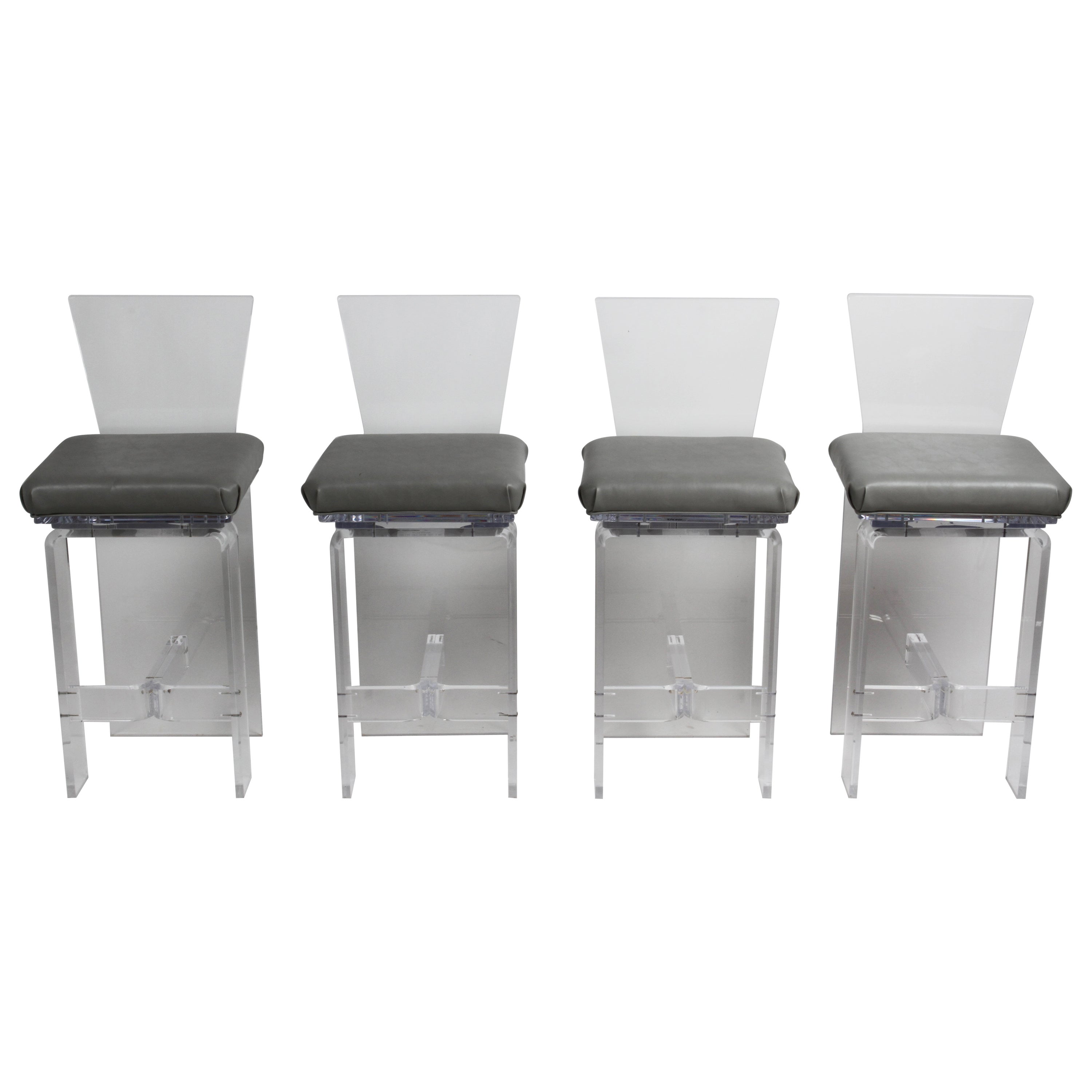 Set vintage di quattro sgabelli girevoli in lucite AKKO in stile Hollywood Regency in vendita