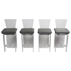 Set vintage di quattro sgabelli girevoli in lucite AKKO in stile Hollywood Regency