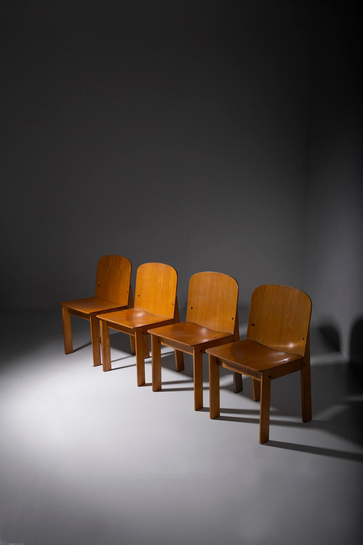 Picture a set of four Italian chairs from the 1960s, crafted from the warm, inviting wood of ash trees. These chairs are a testament to the elegance of simplicity, with their geometric forms and clean, linear lines.

What truly sets these chairs