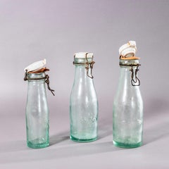 Vintage Set Of French Glass Bottles With Caps - Set Of Three