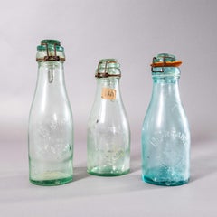 Vintage Set Of French Glass Bottles With Caps - Set Of Three
