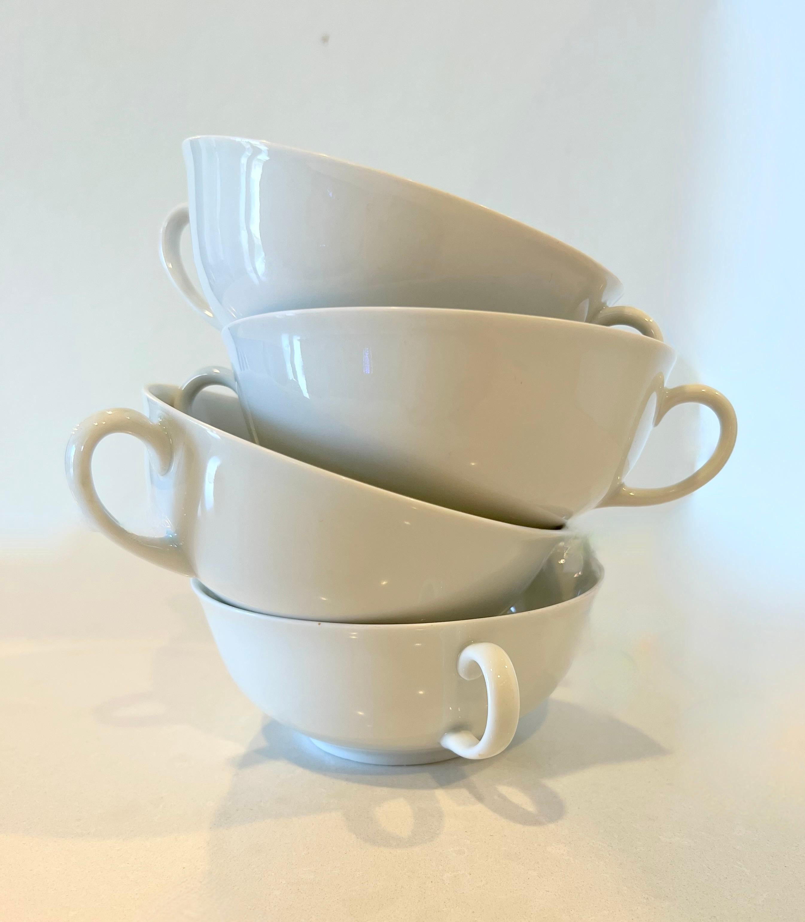 Set of four vintage double-handle white teacups perfect for those with shaky or arthritic hands.  Marked Arzberg, Germany 313..  Made of beautiful white porcelain.  These are solid but lightweight.  Excellent condition, no chips or cracks or