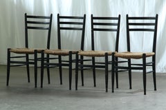 Conjunto vintage de sillas de comedor italianas de cordón de papel negro, con asiento trenzado, de los años 50