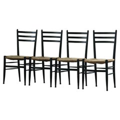 Conjunto vintage de sillas de comedor italianas de cordón de papel negro, con asiento trenzado, de los años 50