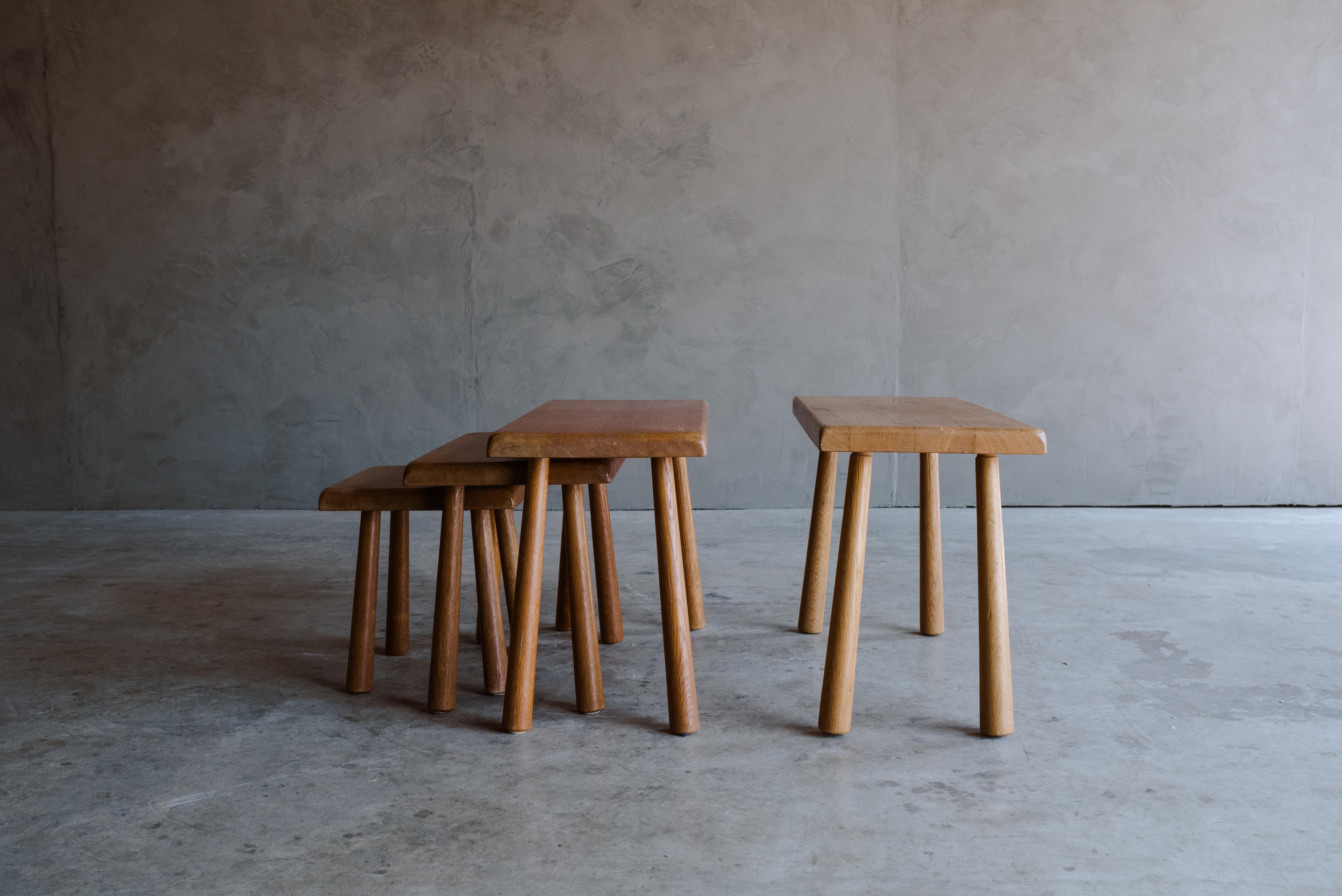 Vintage set of oak nesting tables from France, Circa 1960. Solid oak construction with light wear and patina.