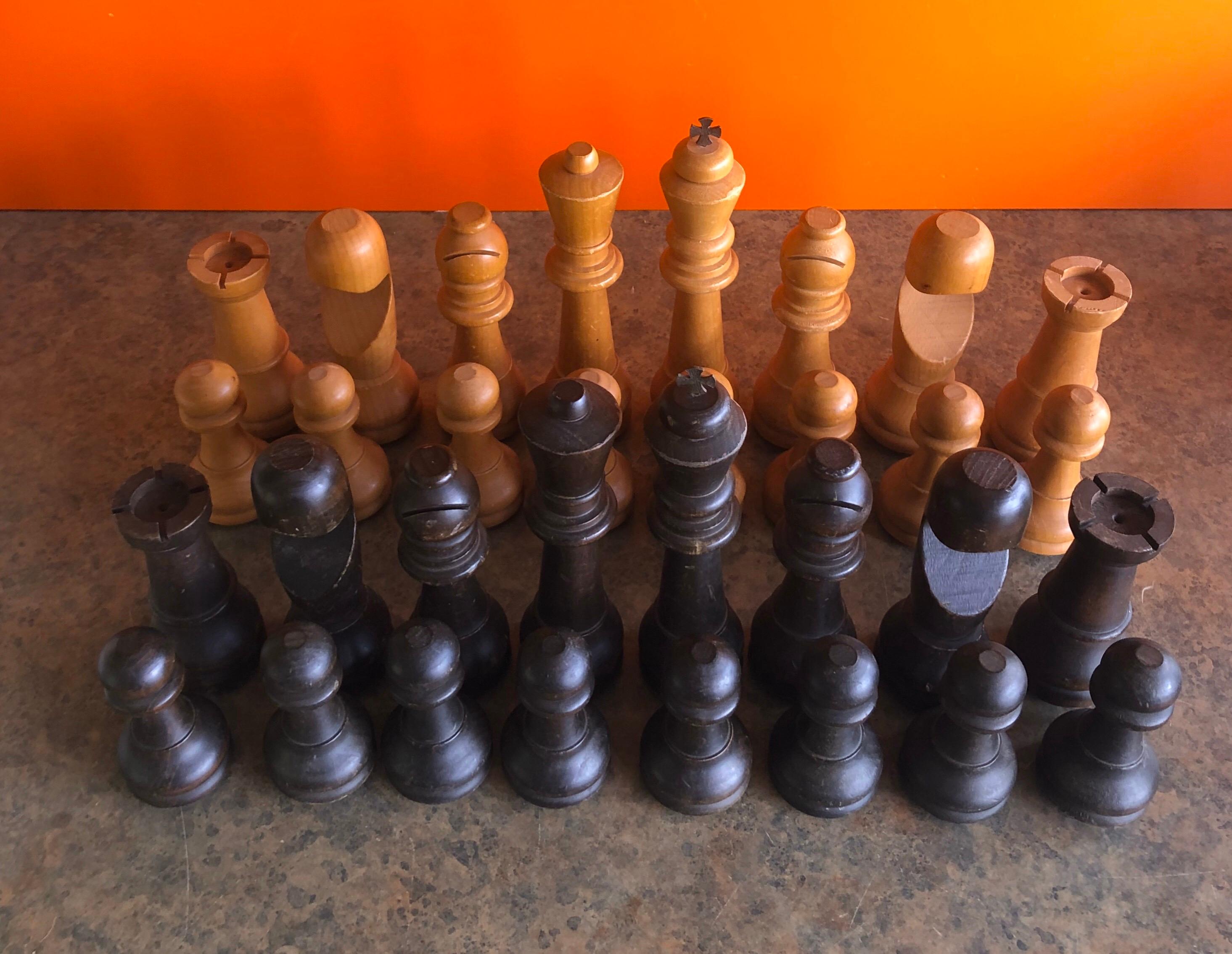 Vintage set of oversized hand carved wooden chess pieces, circa 1970s. The pawns measure 4.5