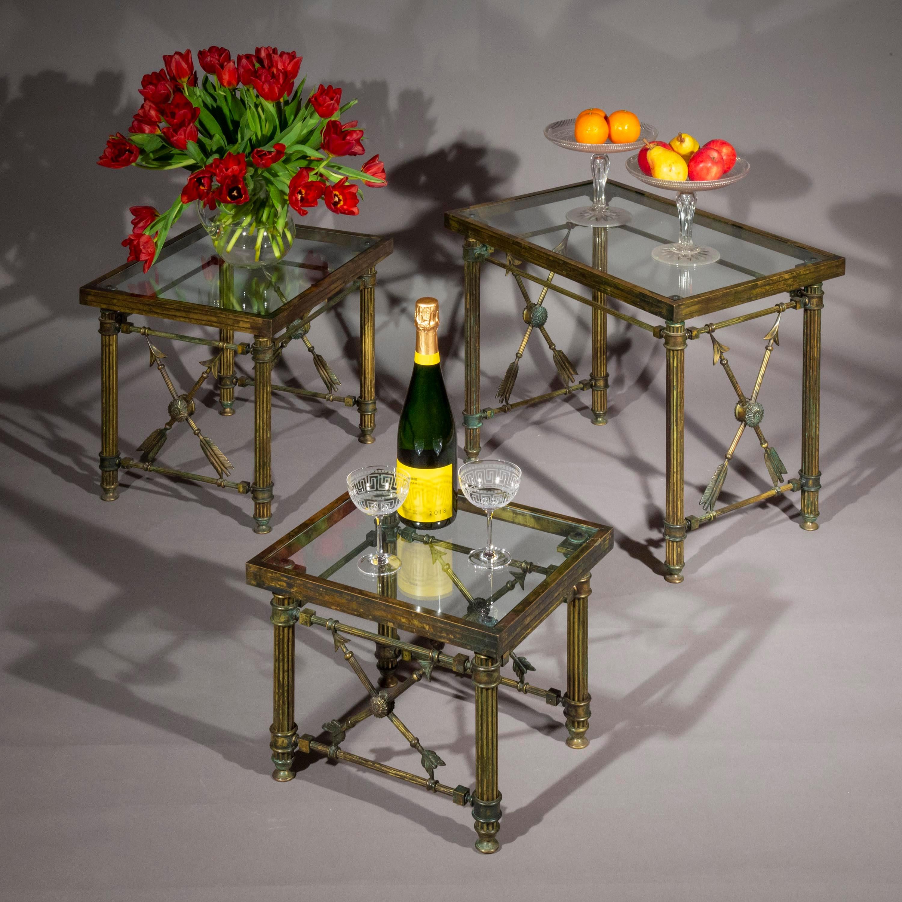 A superb quality graduated set of three solid bronze cocktail tables of 'Pompeian' style, decorated with Cupid's arrows
France, mid-20th century.

Why we like them
An impossibly chic set of low tables to up your cocktail game. Timeless classical
