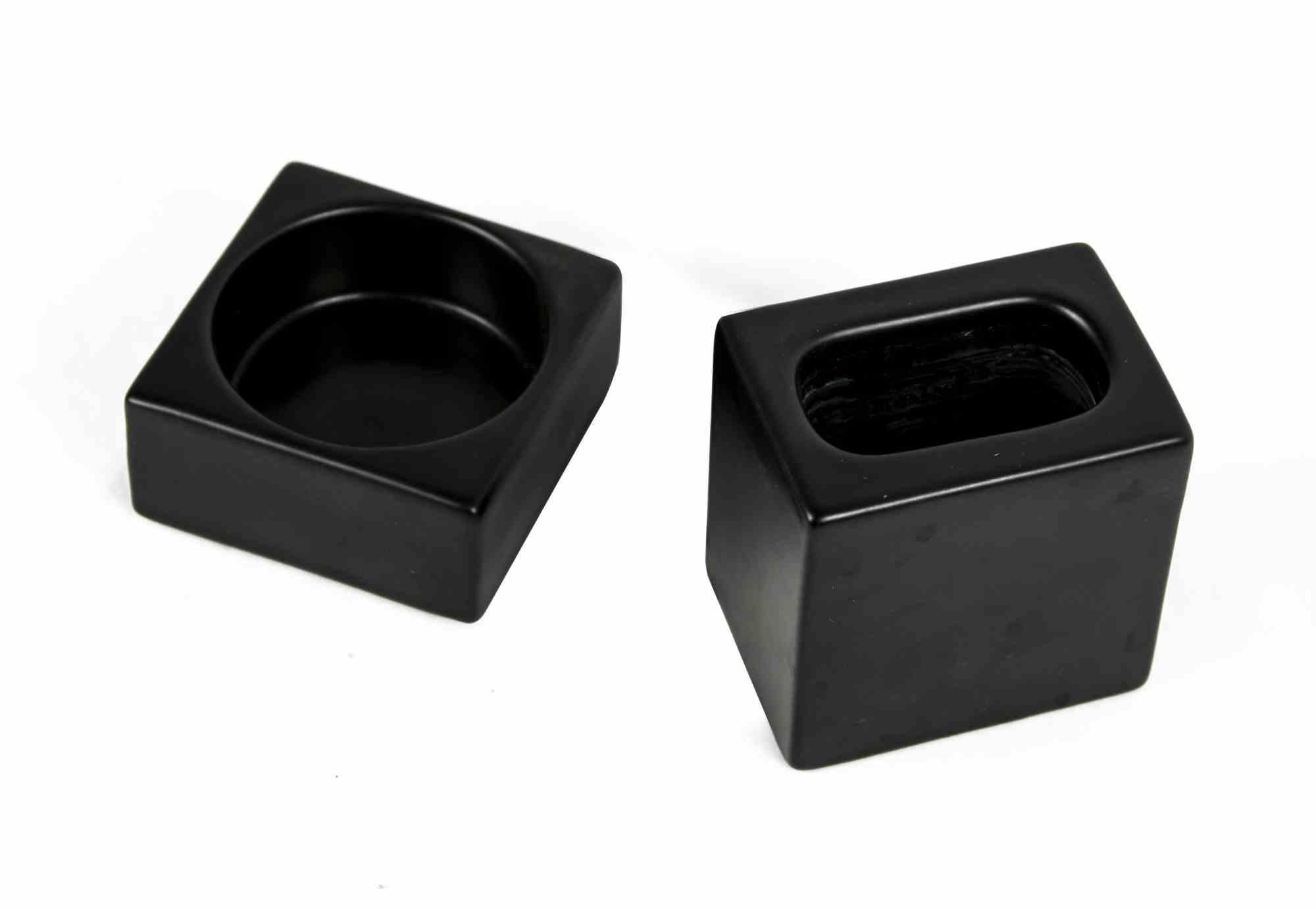 Vintage set of Pozzi Ceramics is an original set of decorative objects realized by Pozzi Ceramiche in the 1970s.

Set of black ceramics designed by Pierre Cardin for Pozzi Ceramiche (as reported on the label).

The set consist of two black