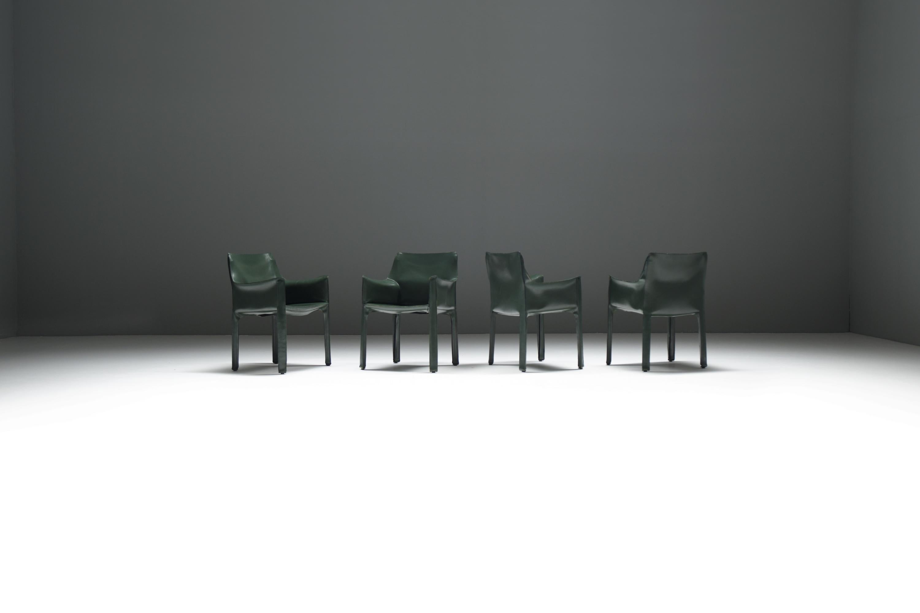 A pristine set of early Cab 413 dining chairs, upholstered in exceptionally rare dark green leather. These iconic, stylish armchairs offer outstanding comfort and showcase a rich patina that enhances their timeless appeal.

Designer : Mario