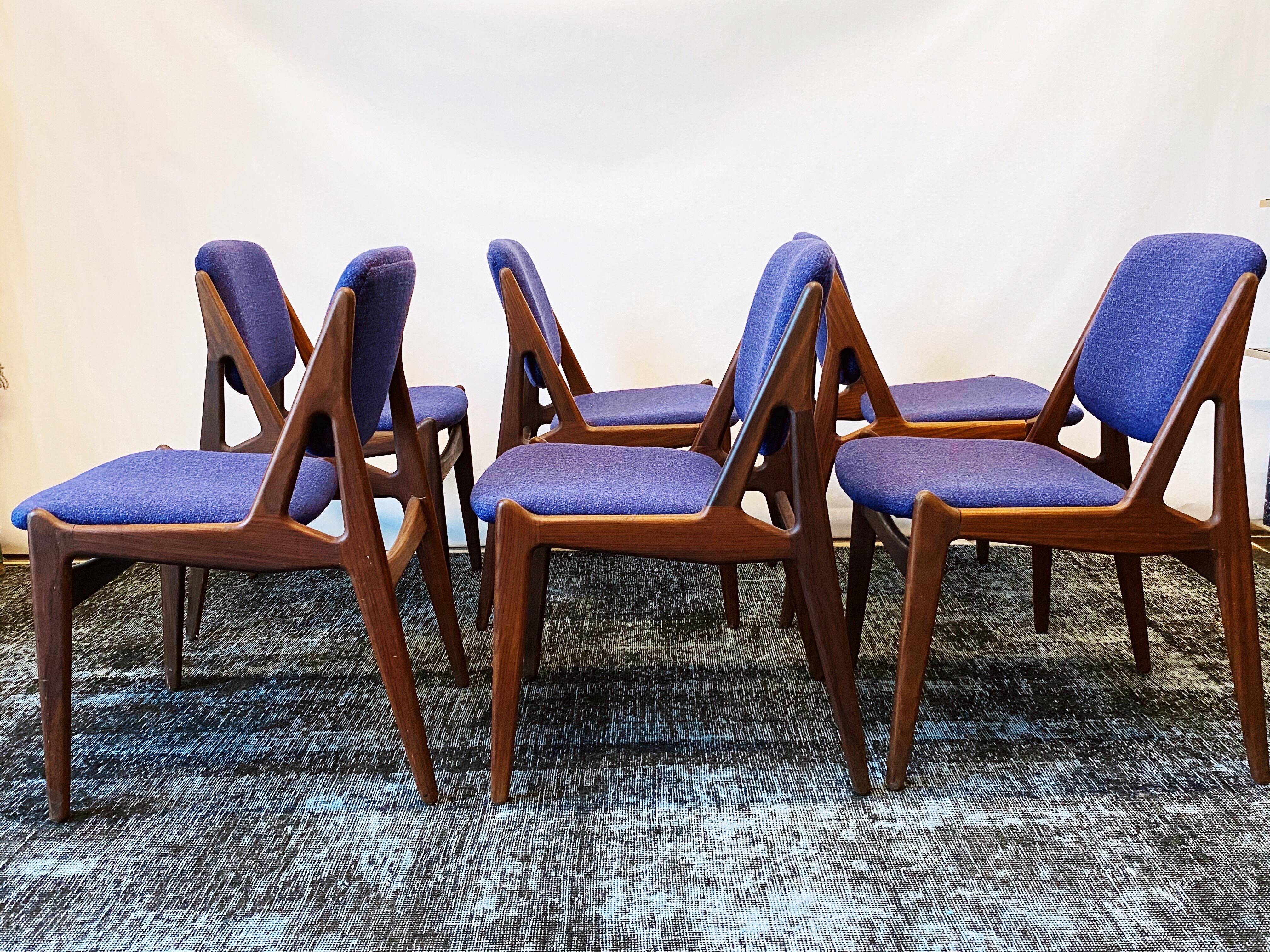 This vintage set of six Danish modern dining chairs by Arne Vodder are in overall good condition. Afromosia frames. New blue and purple wool tweed upholstery and foam. The backs of these chairs pivot for comfort. Shows wear consistent with age and