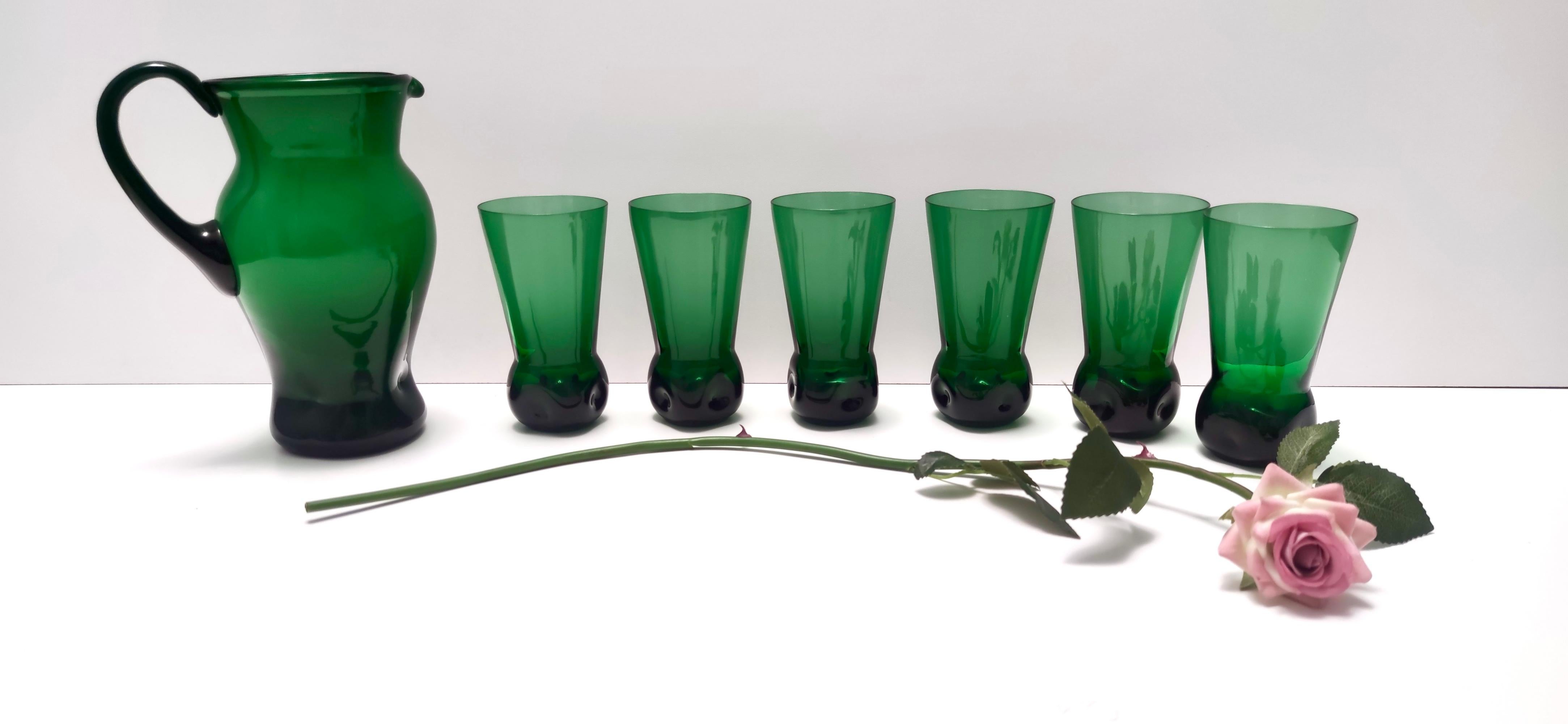 Made in Italy, 1950s.
Made in hand-blown glass, in Empoli: as a matter of fact the same drinking glass with a slightly different shape, is in the Glass Museum in Empoli.
It is a vintage set, therefore it might show slight traces of use, but it can