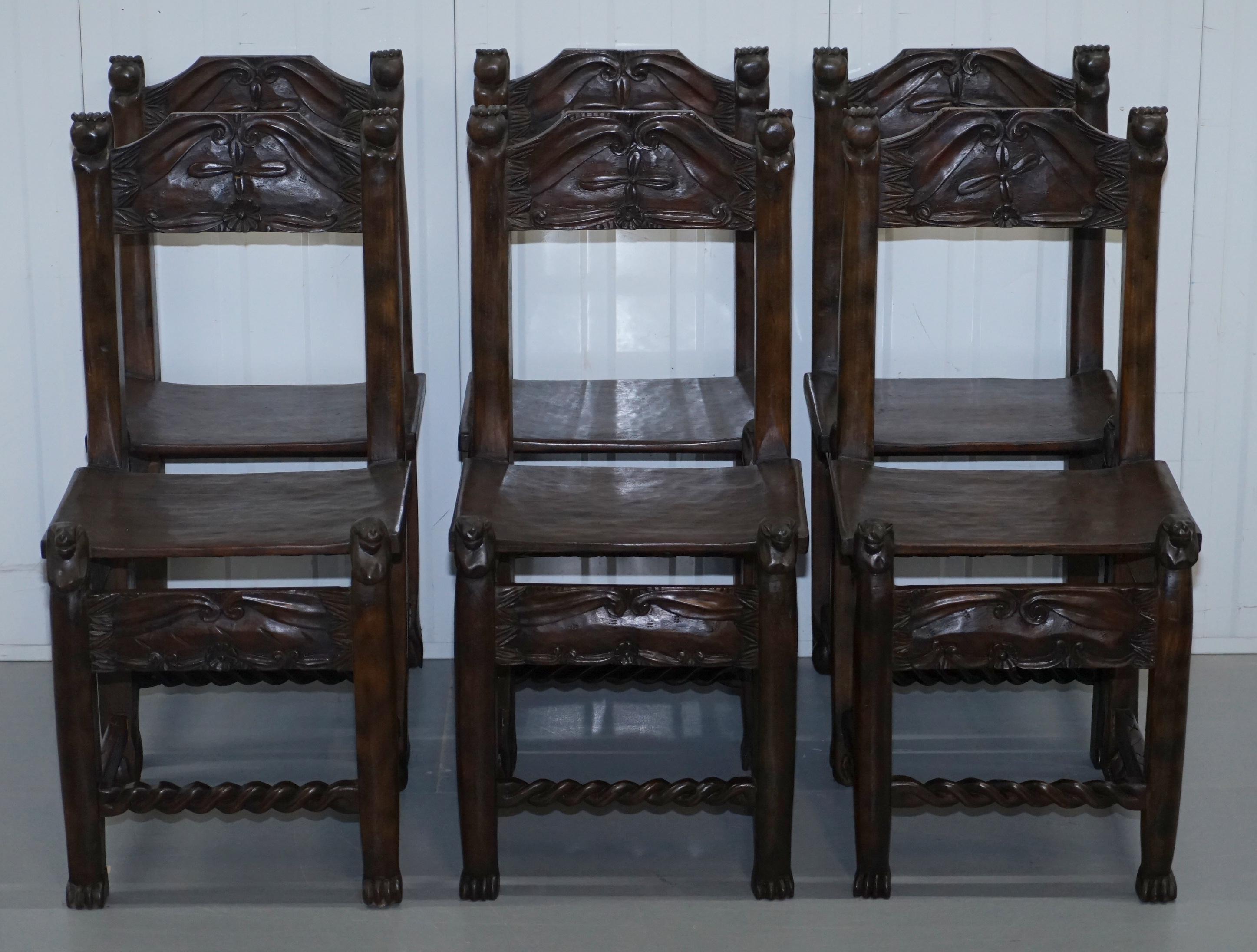 We are delighted to offer for sale this lovely set of six hand-carved wood dining chairs with hand and ball detailing and possibly Lions heads 

A good looking and decorative set, the chair finials have hands holding balls, the seat tops are