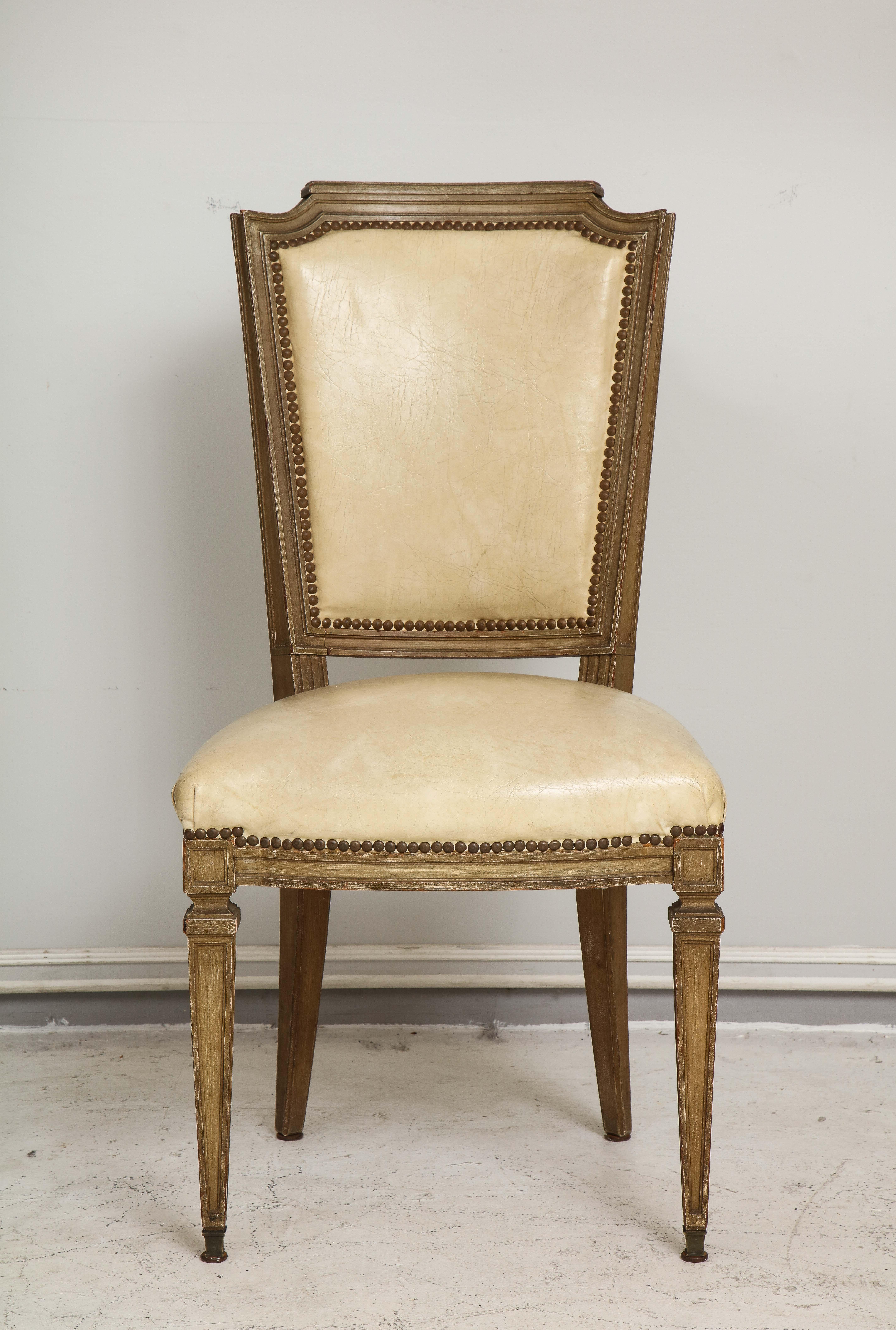 Vintage set of six Louis XVI style painted dining room chairs on tapered legs.