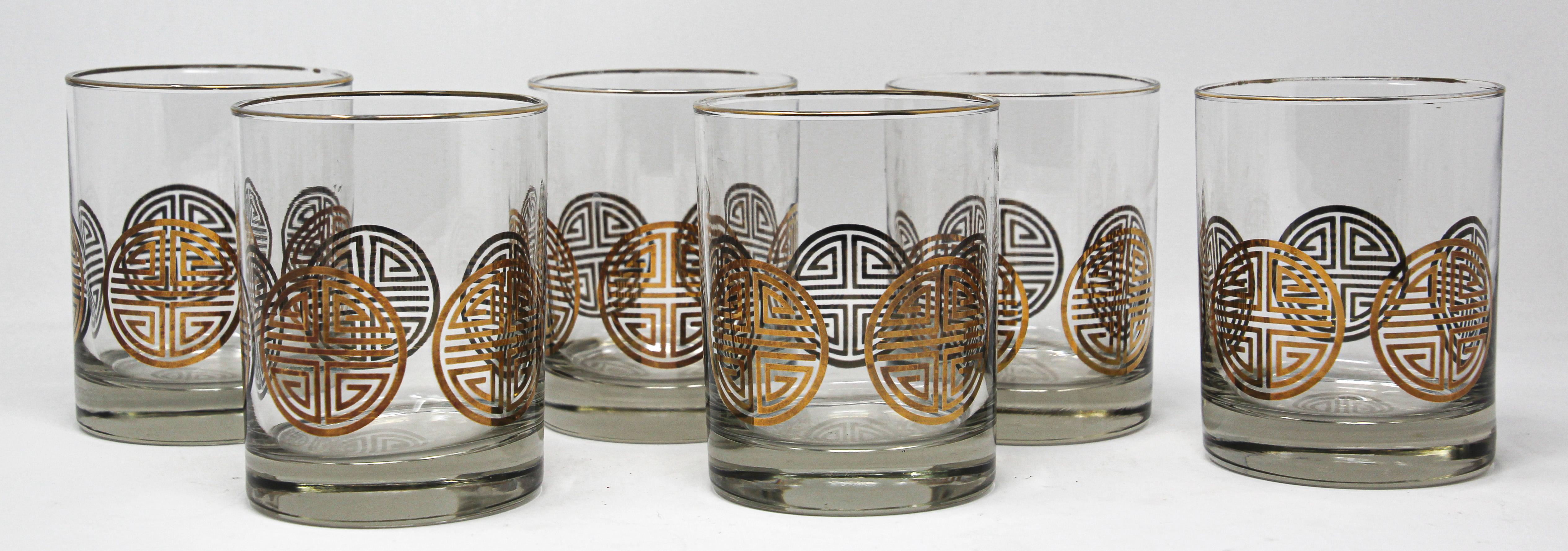 Elegant exquisite vintage set of six rock glasses designed by Georges Briard.
They will create a dramatic display for a back bar or table setting.
Midcentury low ball cocktail glasses decorated with 22-karat gold leaf pattern.
Size: 3 1/4