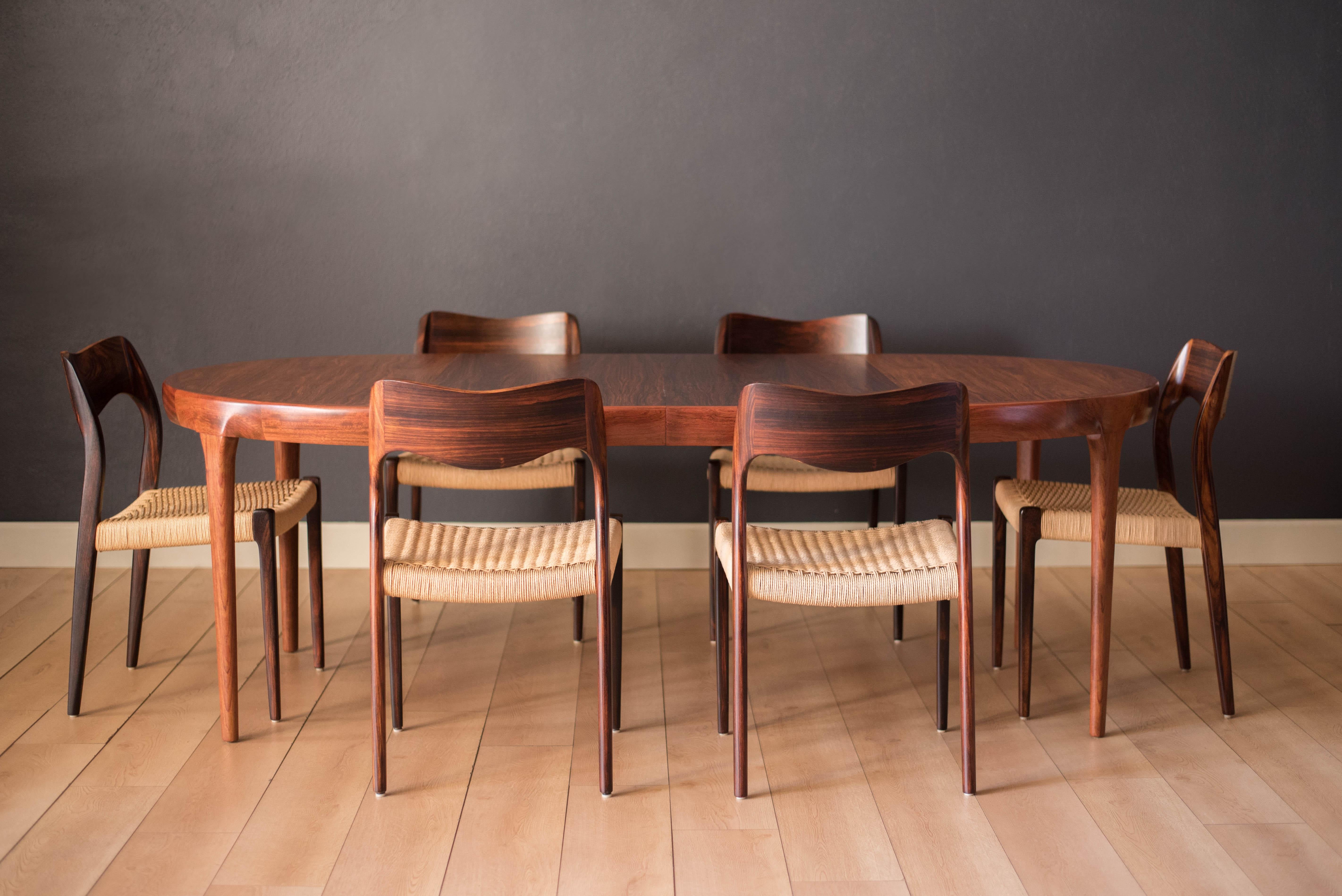 Mid-Century Modern dining chairs by Niels O. Møller for J.L. Møller Møbelfabrik in Brazilian rosewood model no. 71, Denmark. This set retains the original paper cord seats all intact. Price is for the set of six.