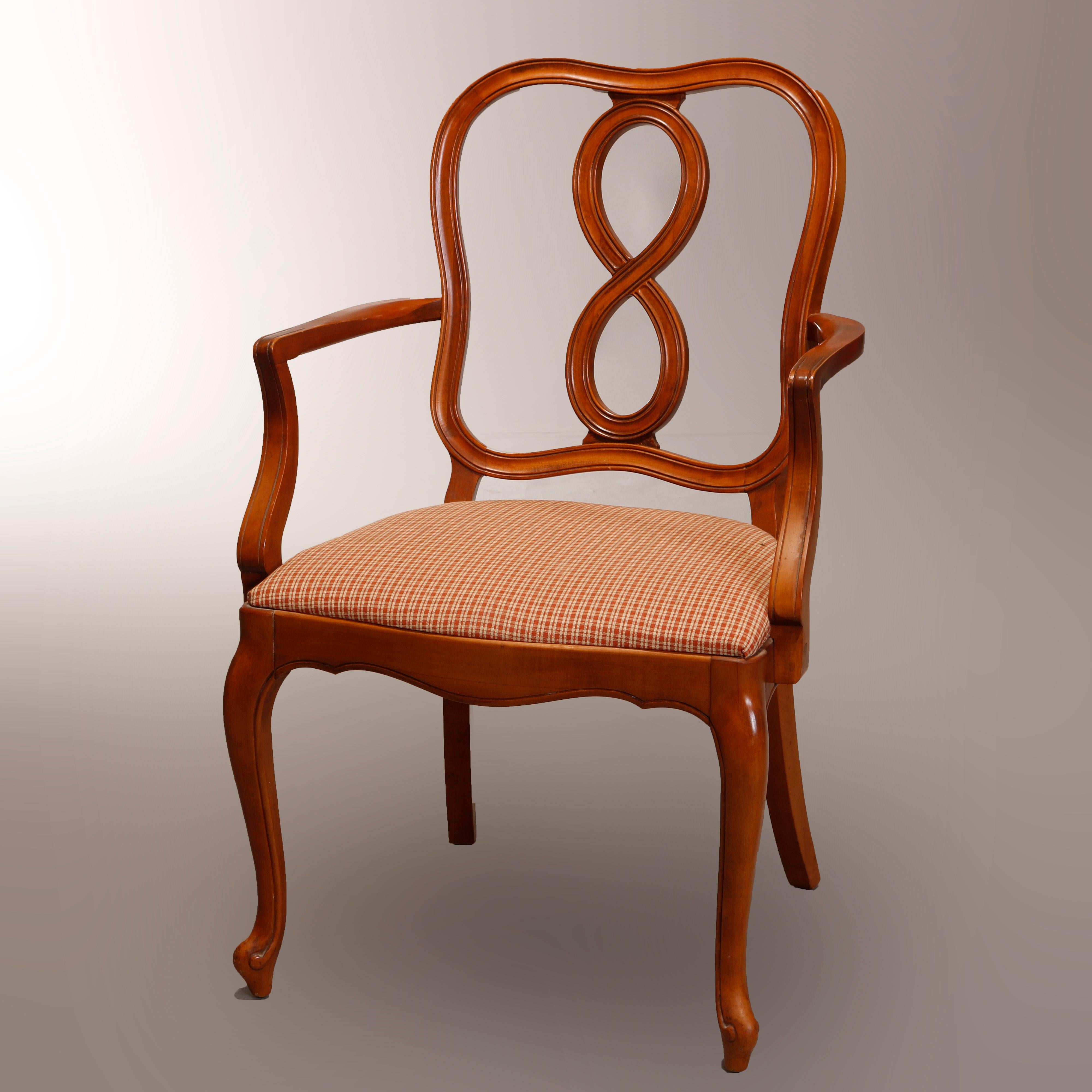 A vintage set of six French country dining chairs offer satinwood construction with ribbon back surmounting upholstered seats and raised on cabriole legs terminating in stylized scroll form feet, set includes two master armchairs and four side