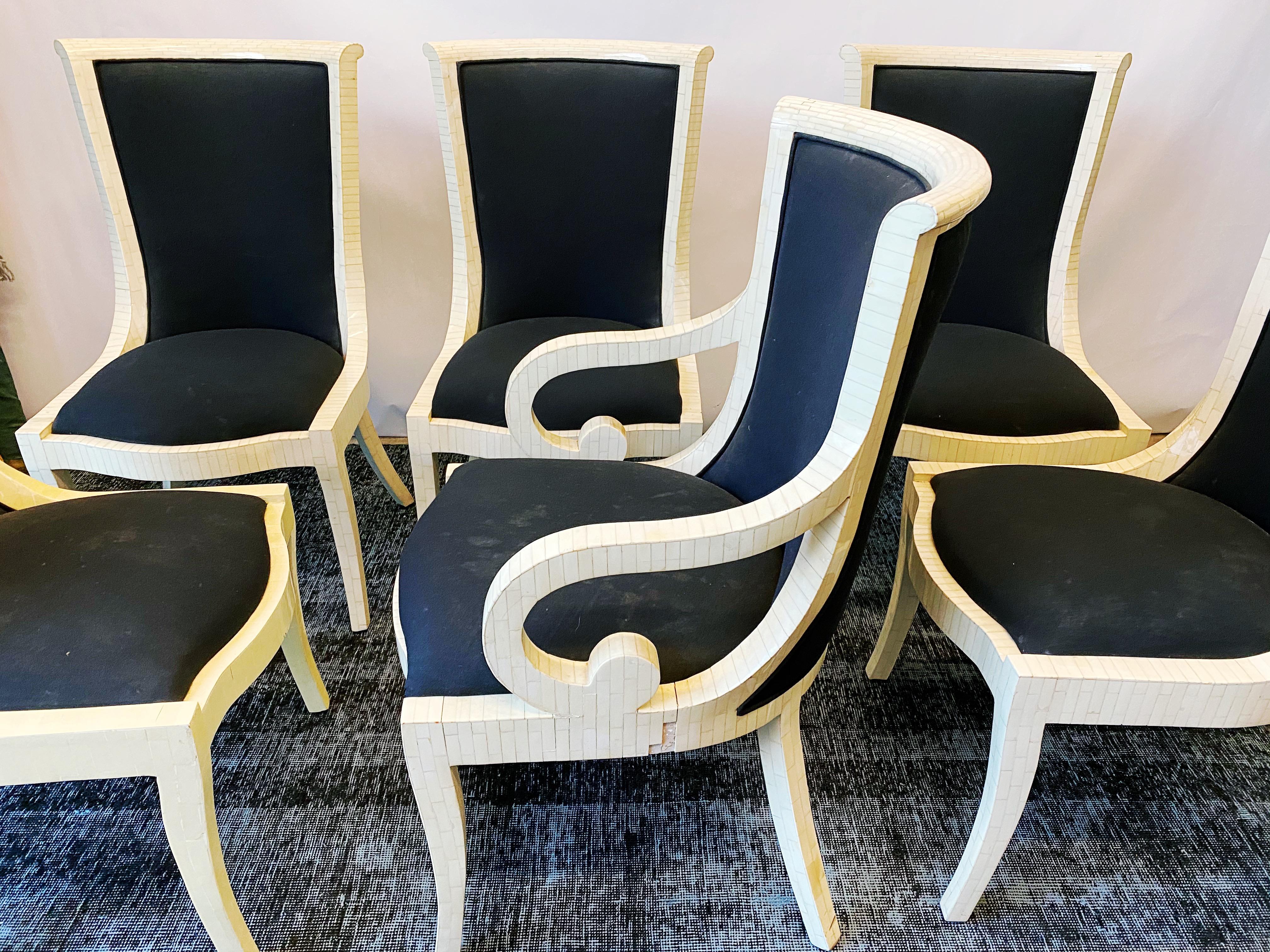 This vintage set of six tessellated bone dining chairs by Enrique Garces are in overall good condition. One armchairand live side chairs. Some minor loss of bone tile as seen in photos on two chairs. Some staining on upholstery. Reupholstery