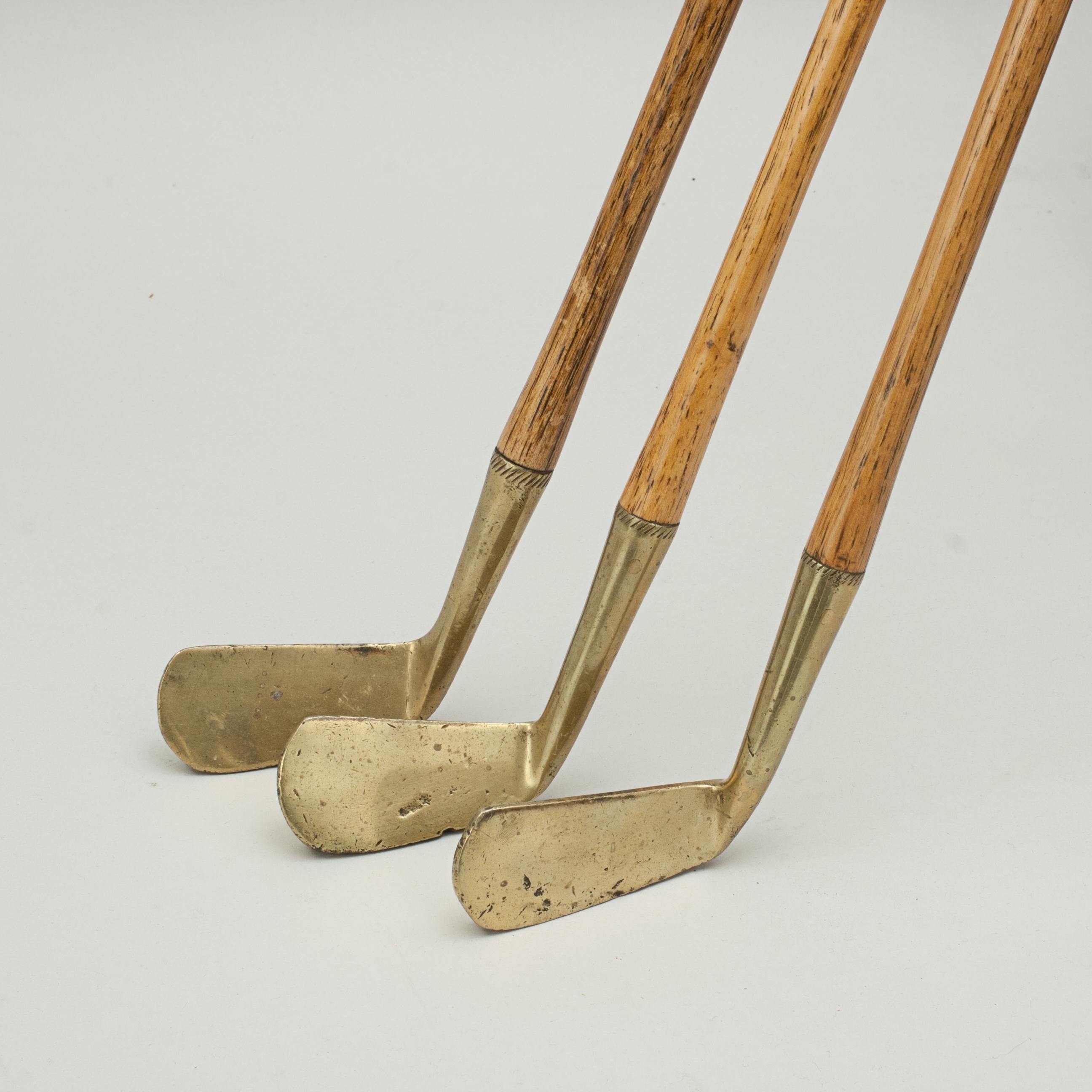 Brass Vintage Set of Three Child's Golf Clubs by Halley & Co For Sale