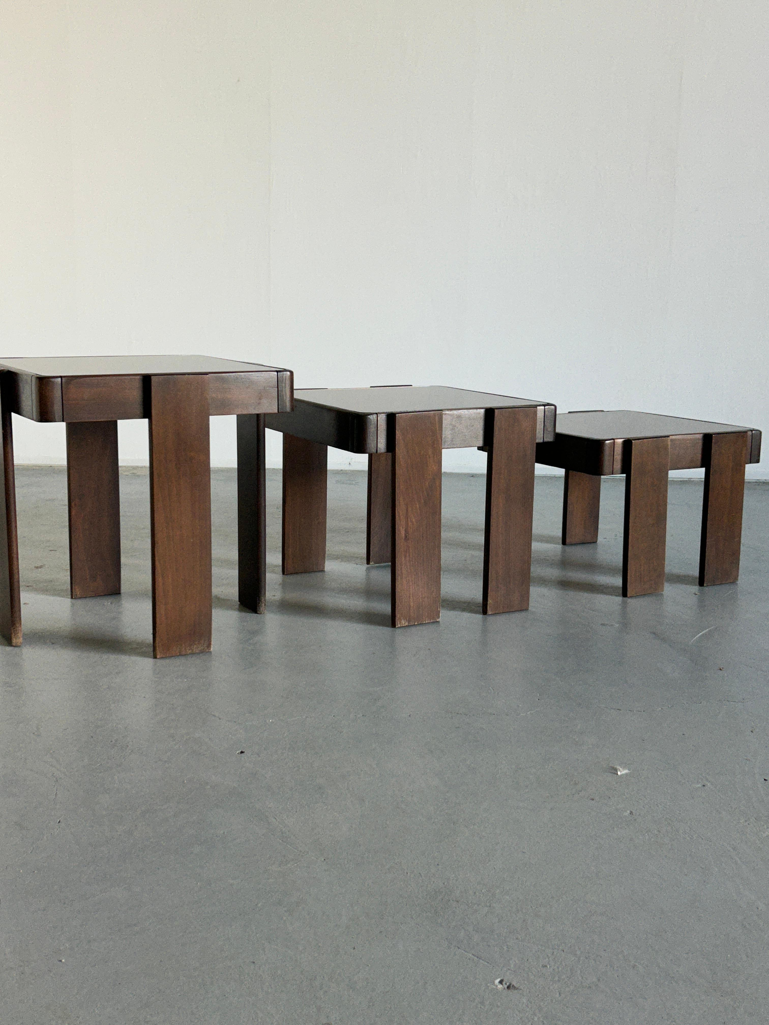 Set of three stacking tables designed by Gianfranco Frattini, for Cassina in the 1970s. 
A vintage Yugoslavian production from the late 1970s or early 1980s (not a Cassina production).

Overall, the tables are in very good vintage condition with no