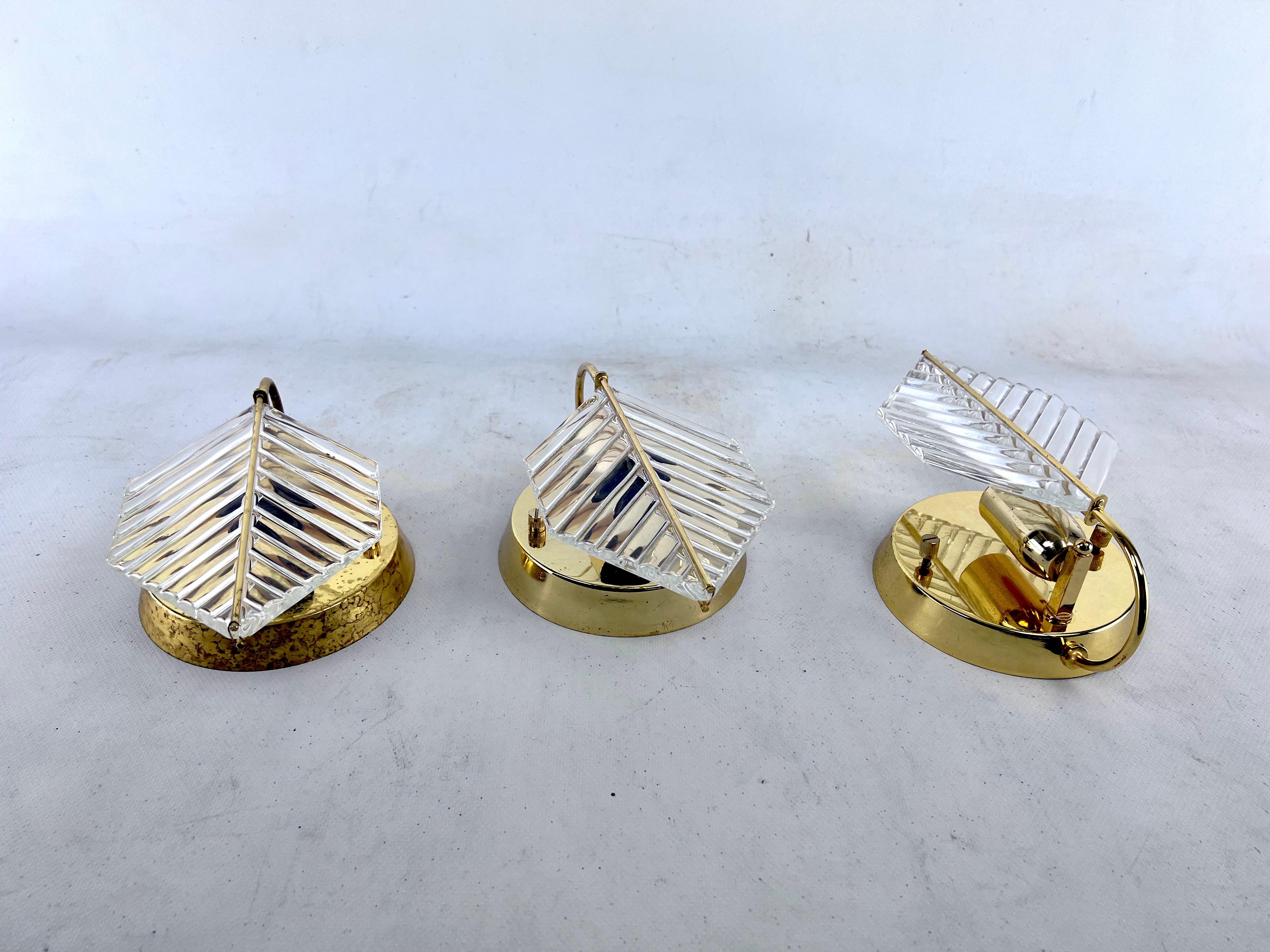 Italian Vintage set of three sconces in brass and glass by Zero Quattro. Italy 1970s For Sale