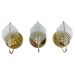 Vintage set of three sconces in brass and glass by Zero Quattro. Italy 1970s